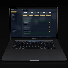 A modern laptop displaying a dark-themed dashboard