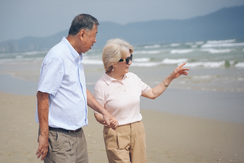 Senior couple enjoying a romantic beach stroll