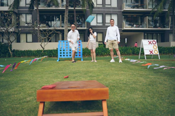 People playing outdoor games on a sunny day