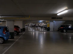 Cars parked in a dimly lit underground garage.