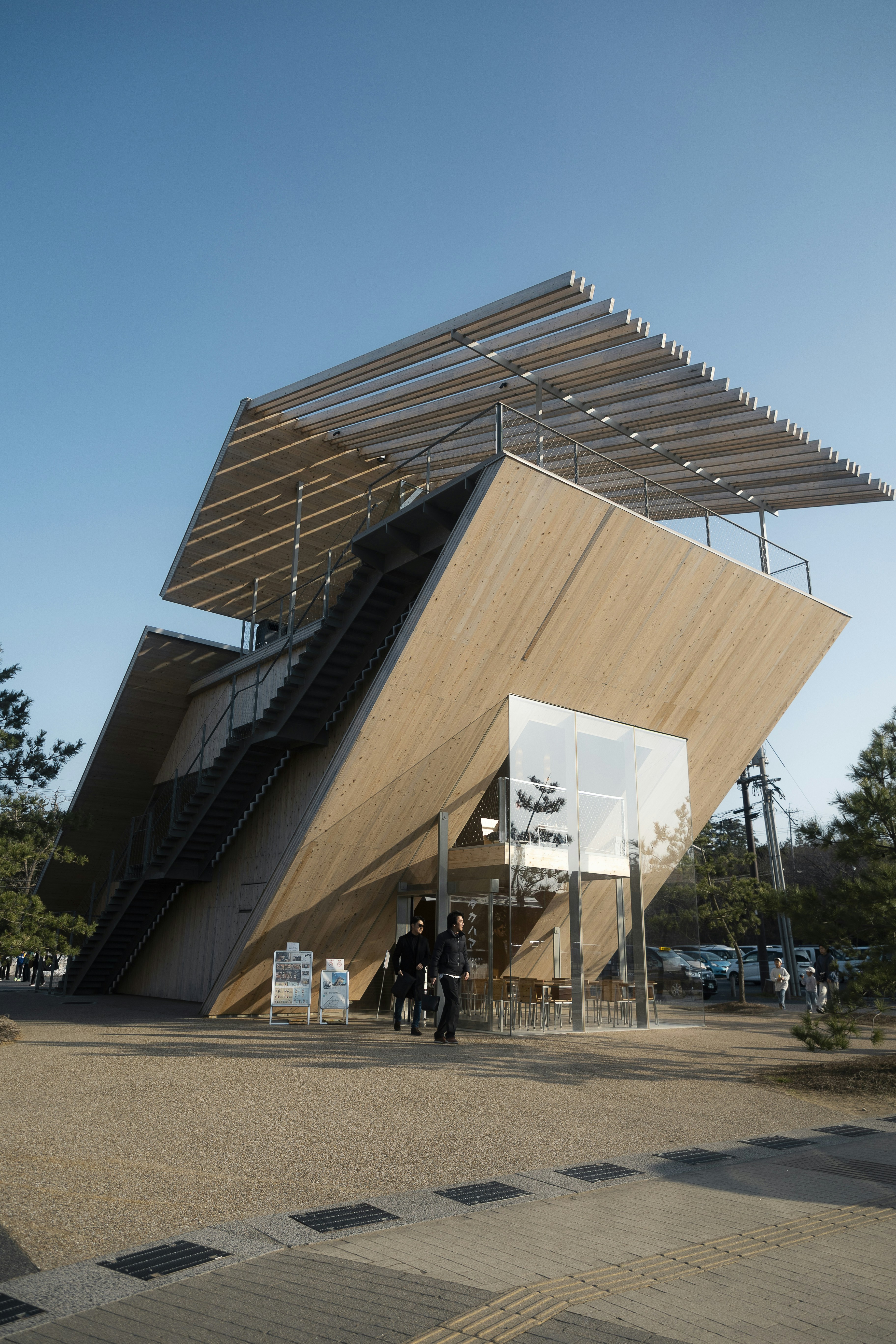 Modern wooden building with angled roof and stairs
