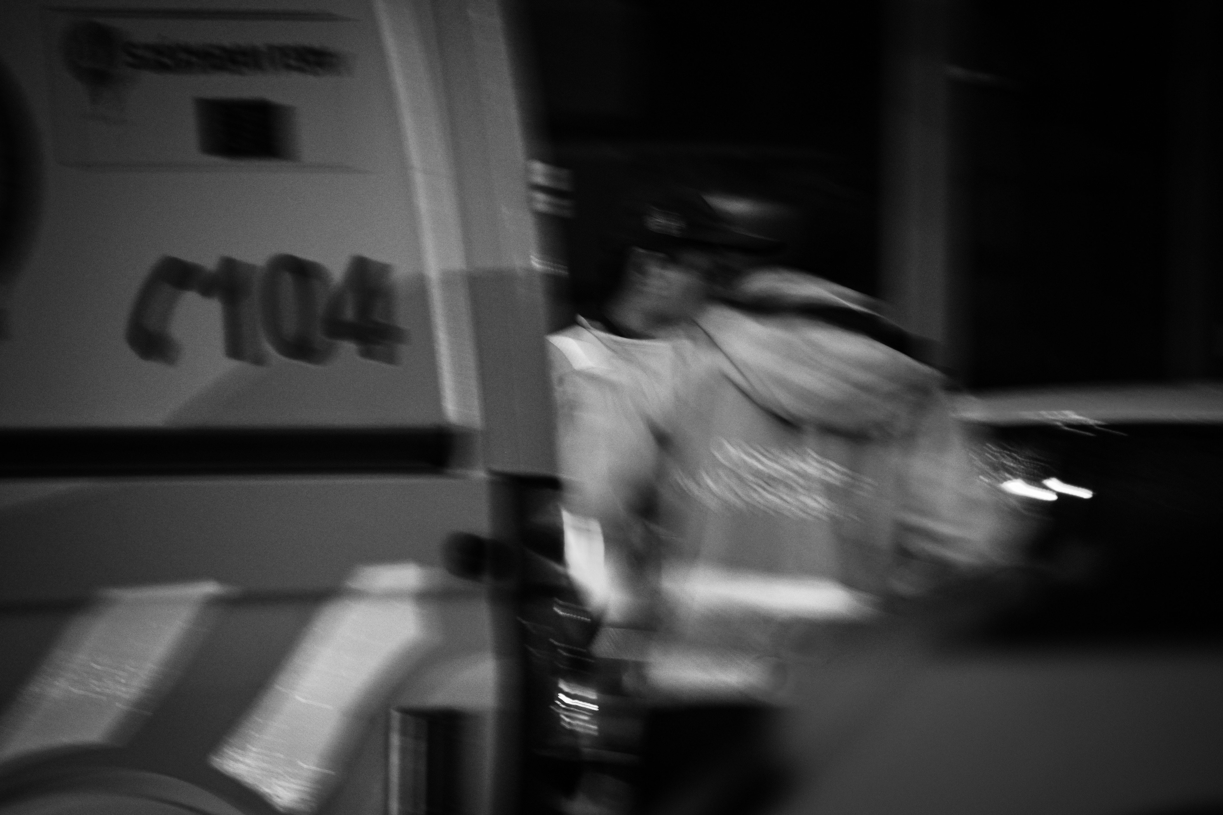 Ambulance crew member in reflective vest at night
