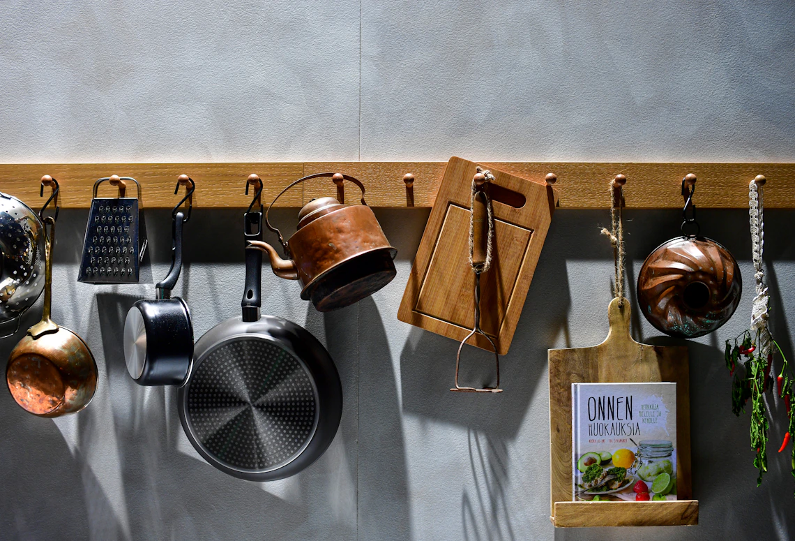 Real kitchen cookware and preparation tools arranged in a practical home kitchen