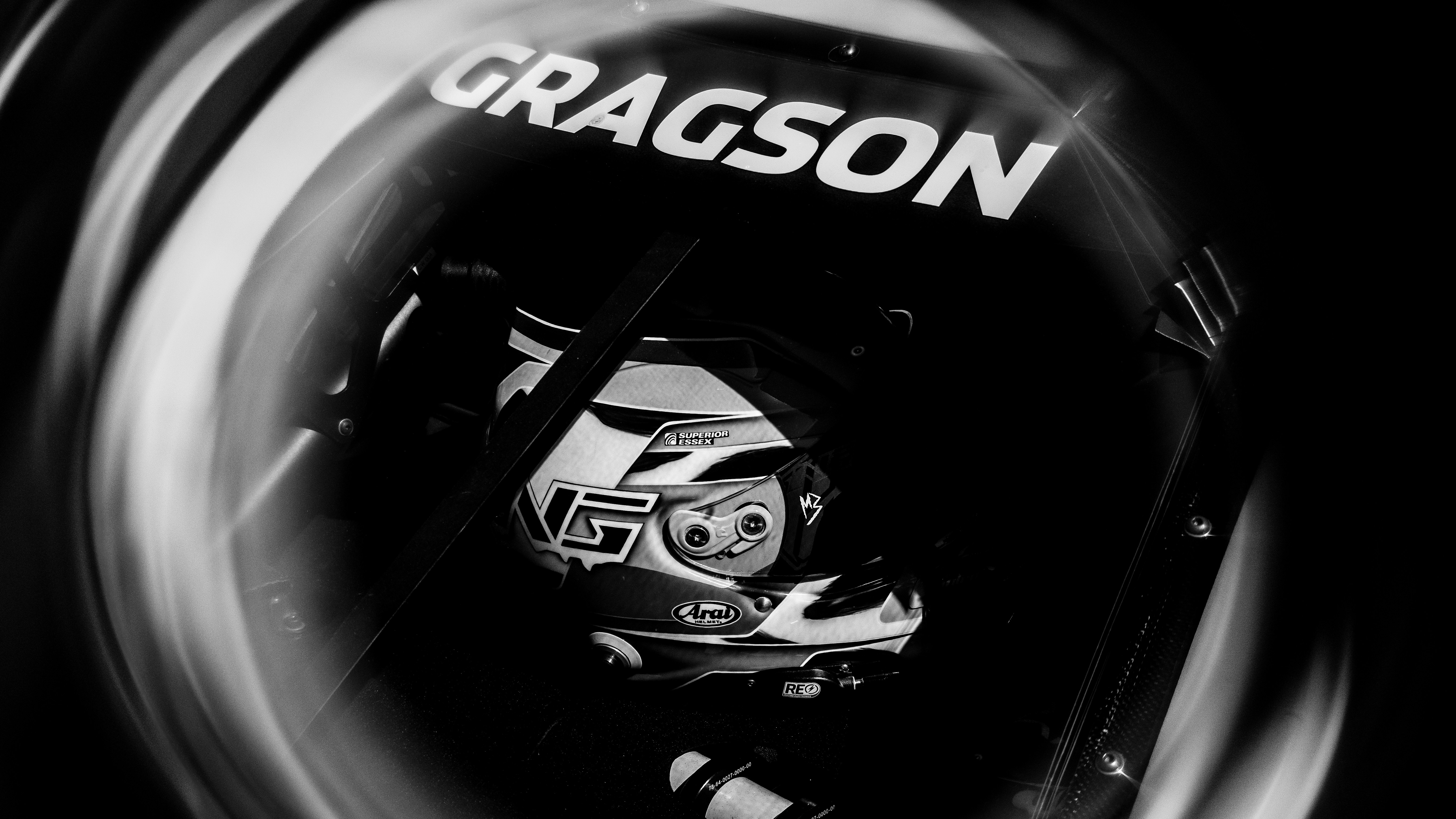 Close-up of a racing helmet with gragson logo.