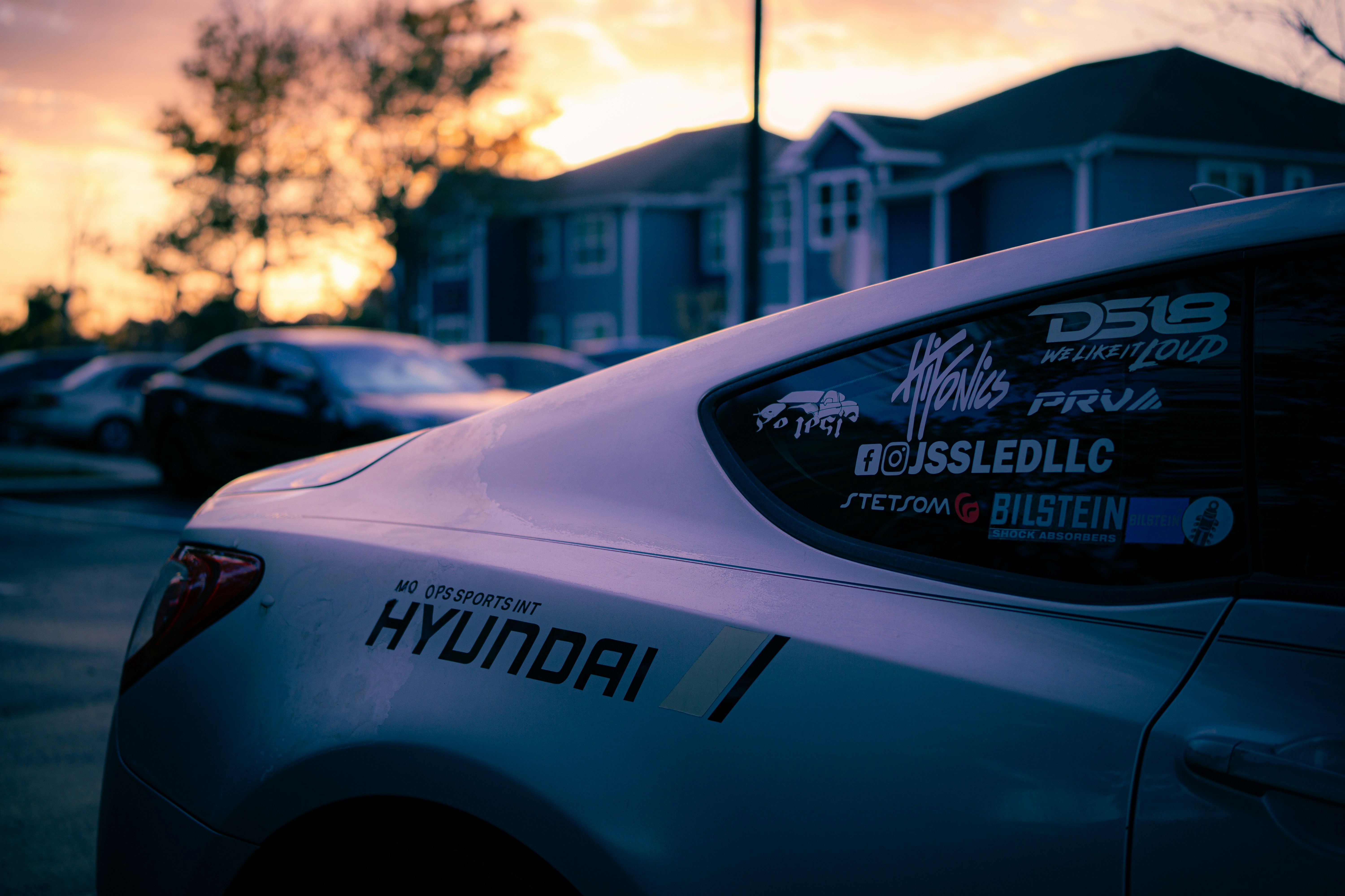 Hyundai car with stickers at sunset