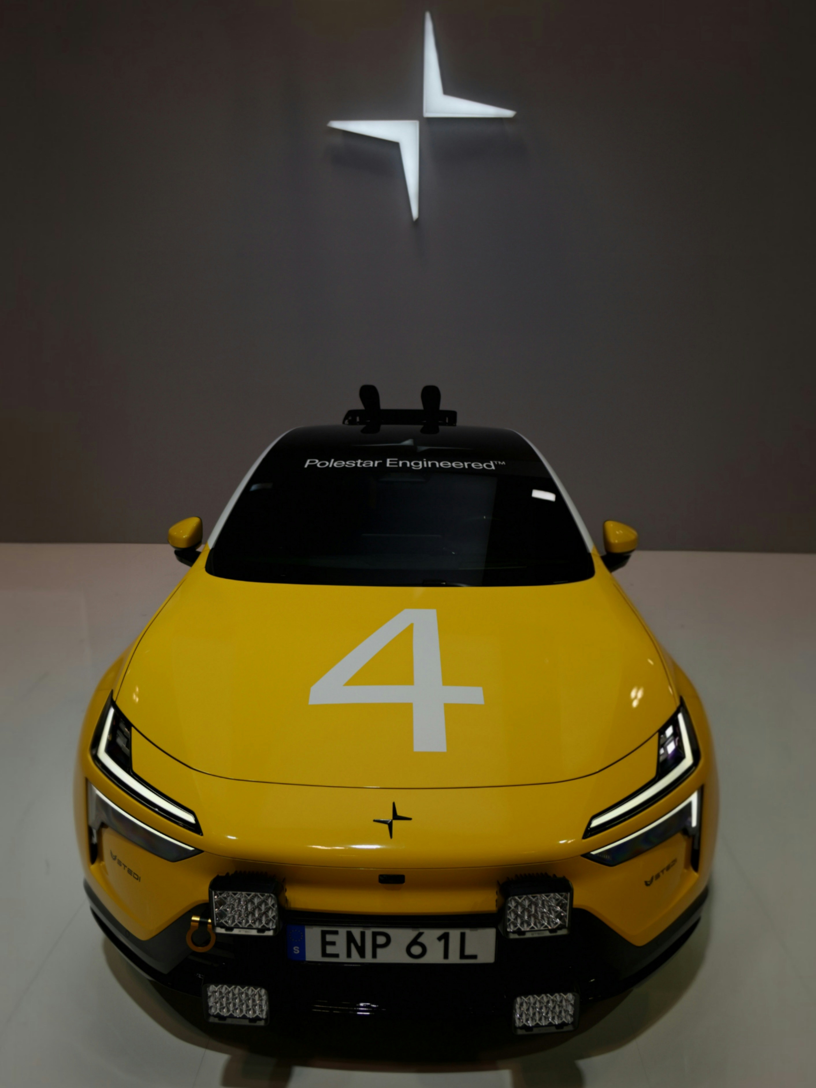 Yellow race car with number 4 and polestar logo.