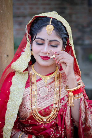 A beautiful bride in traditional indian attire and jewelry.