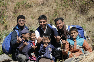Group of people posing for a photo outdoors