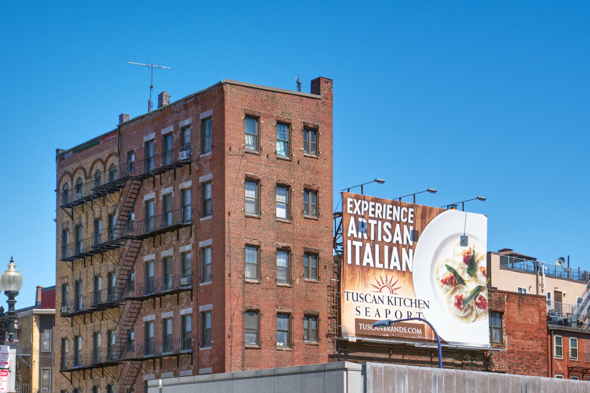 A North End Boston street with a traditional Italian restaurant and red-brick buildings