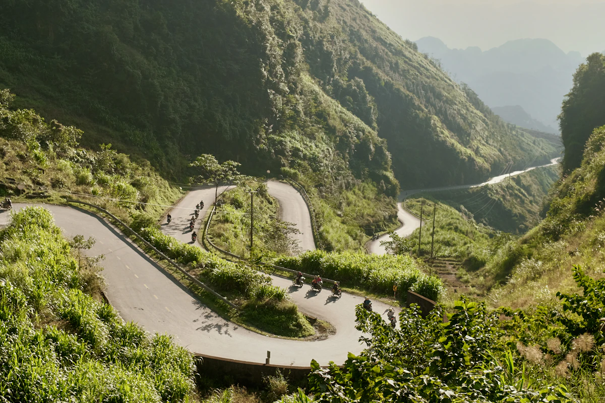Cyclists navigating a winding mountain road during endurance training