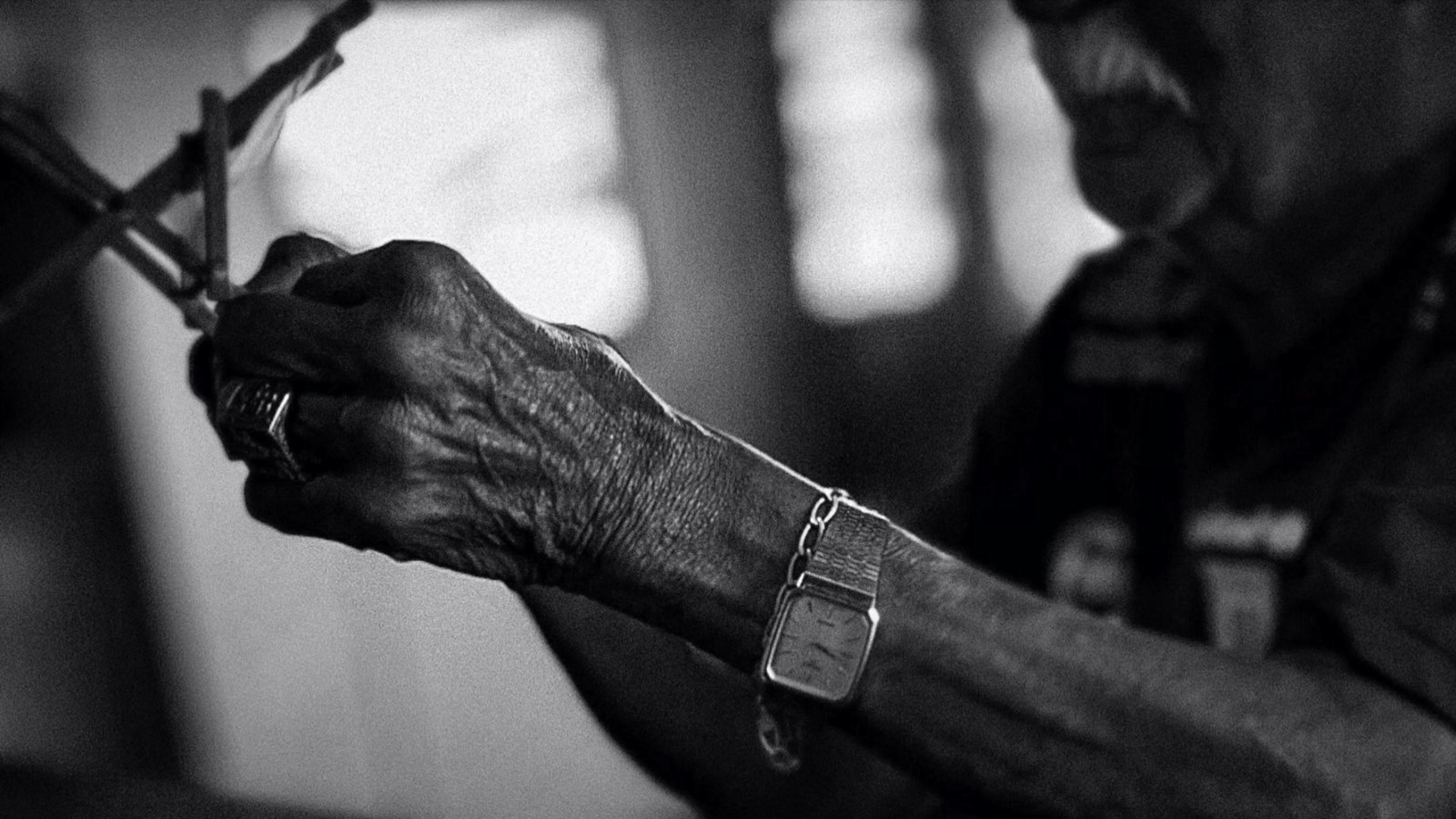 Elderly hands working on a small object