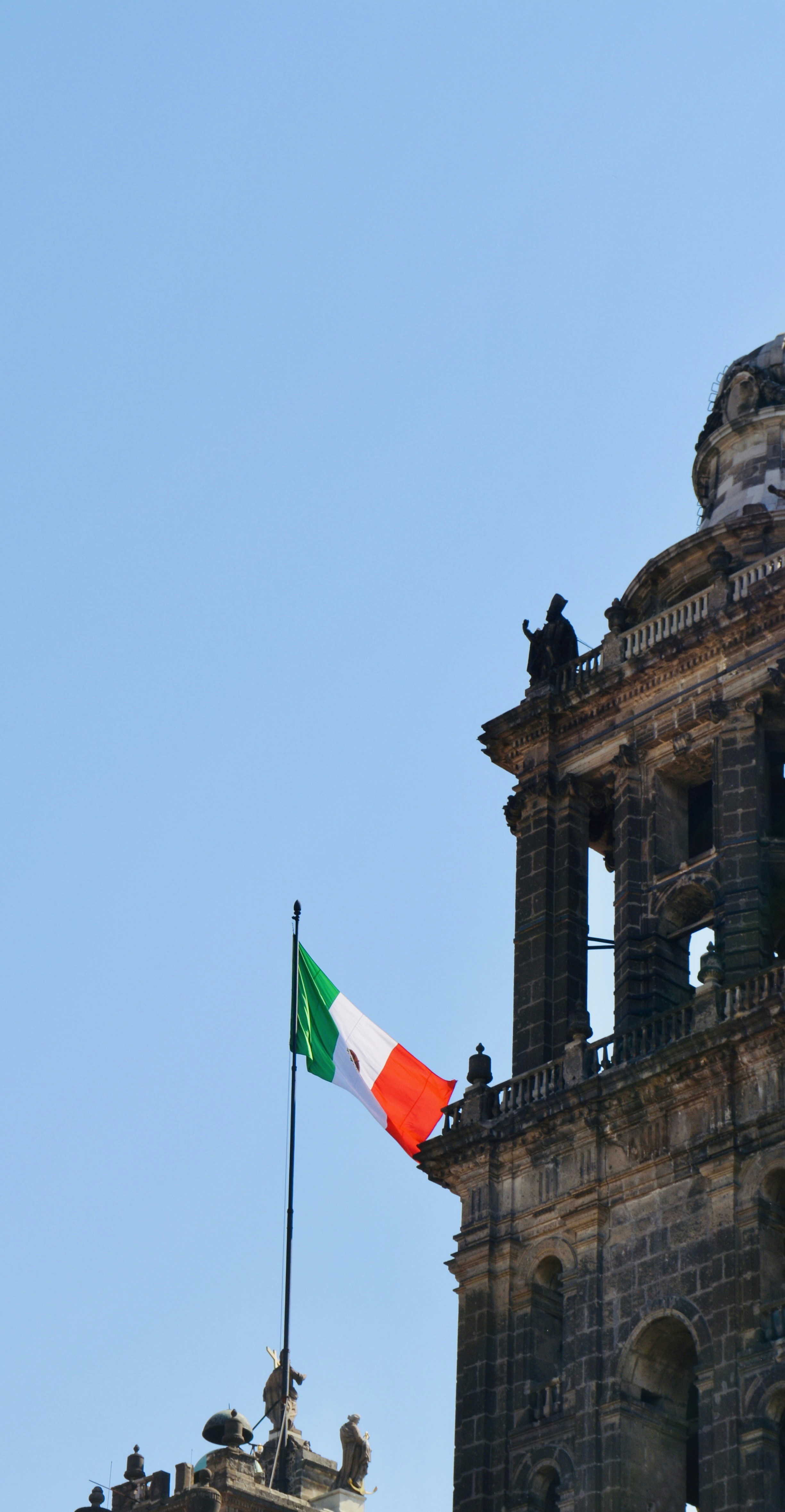 Institutional building with Mexico flag