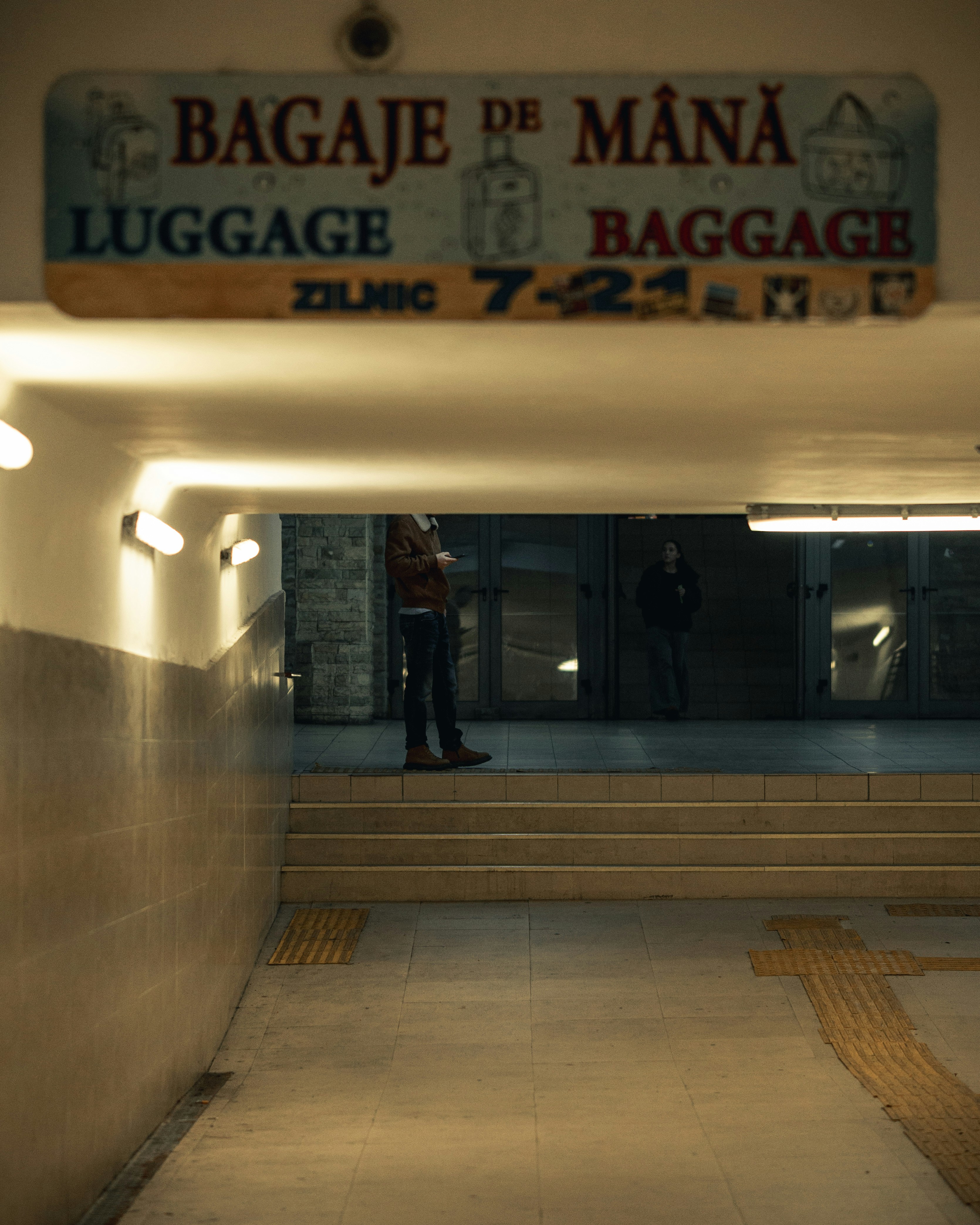 Luggage and baggage sign in a tunnel
