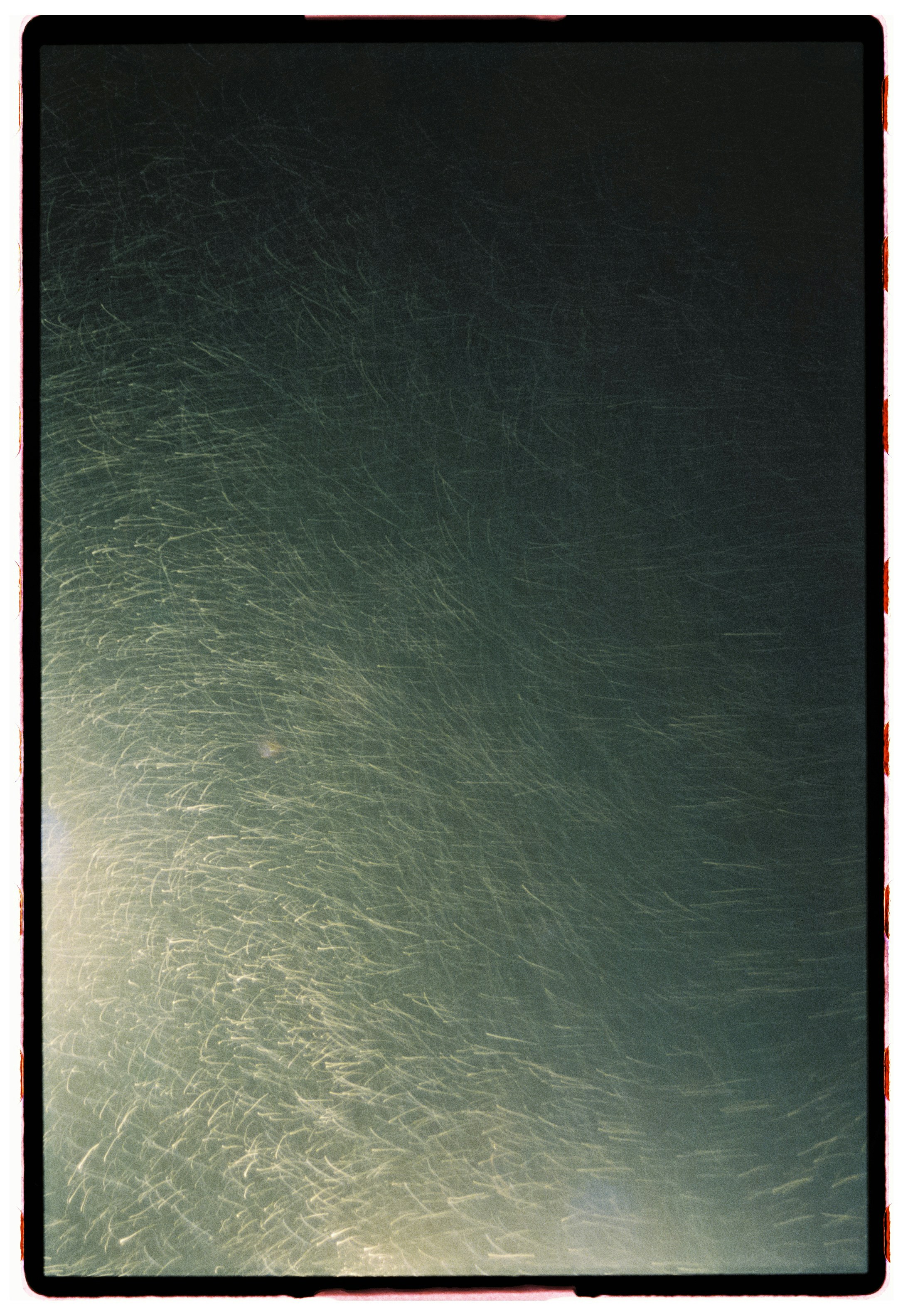 Abstract streaks of light against dark background