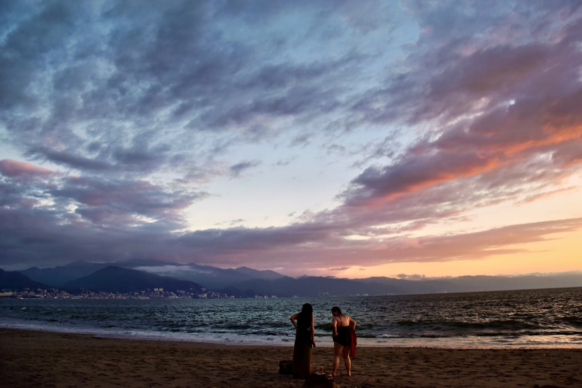 Couple watching the sunset over Banderas Bay