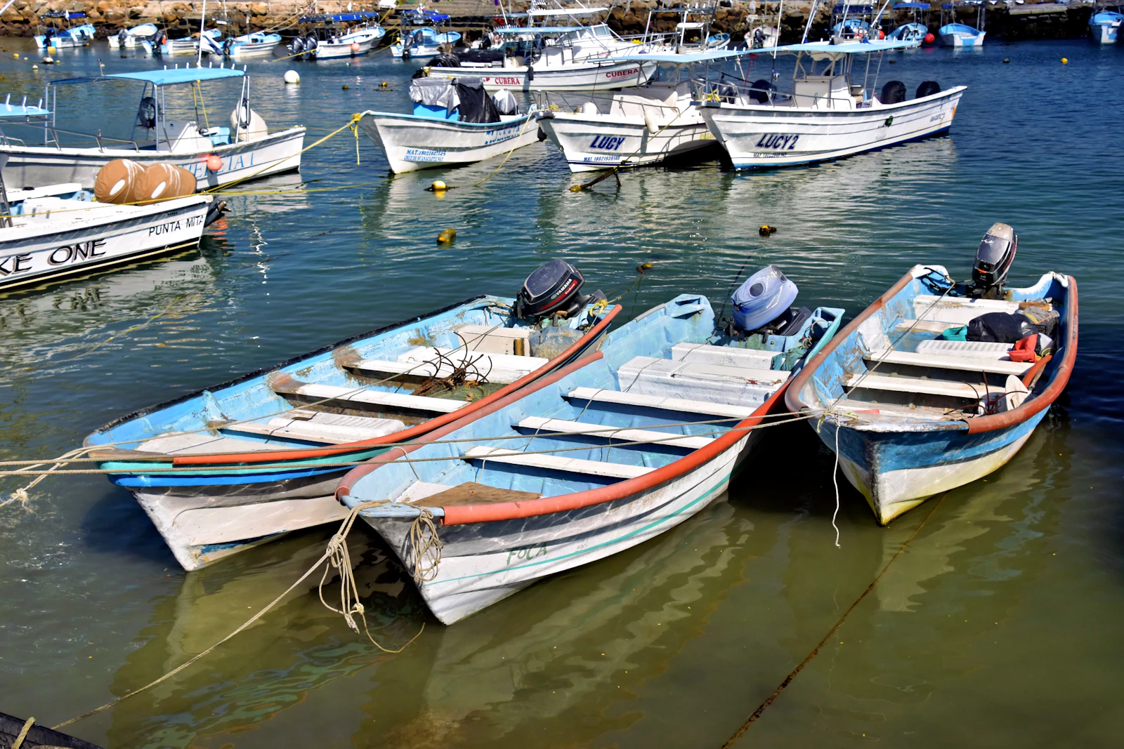 Small fishing boats moored in a Mexican Caribbean harbor