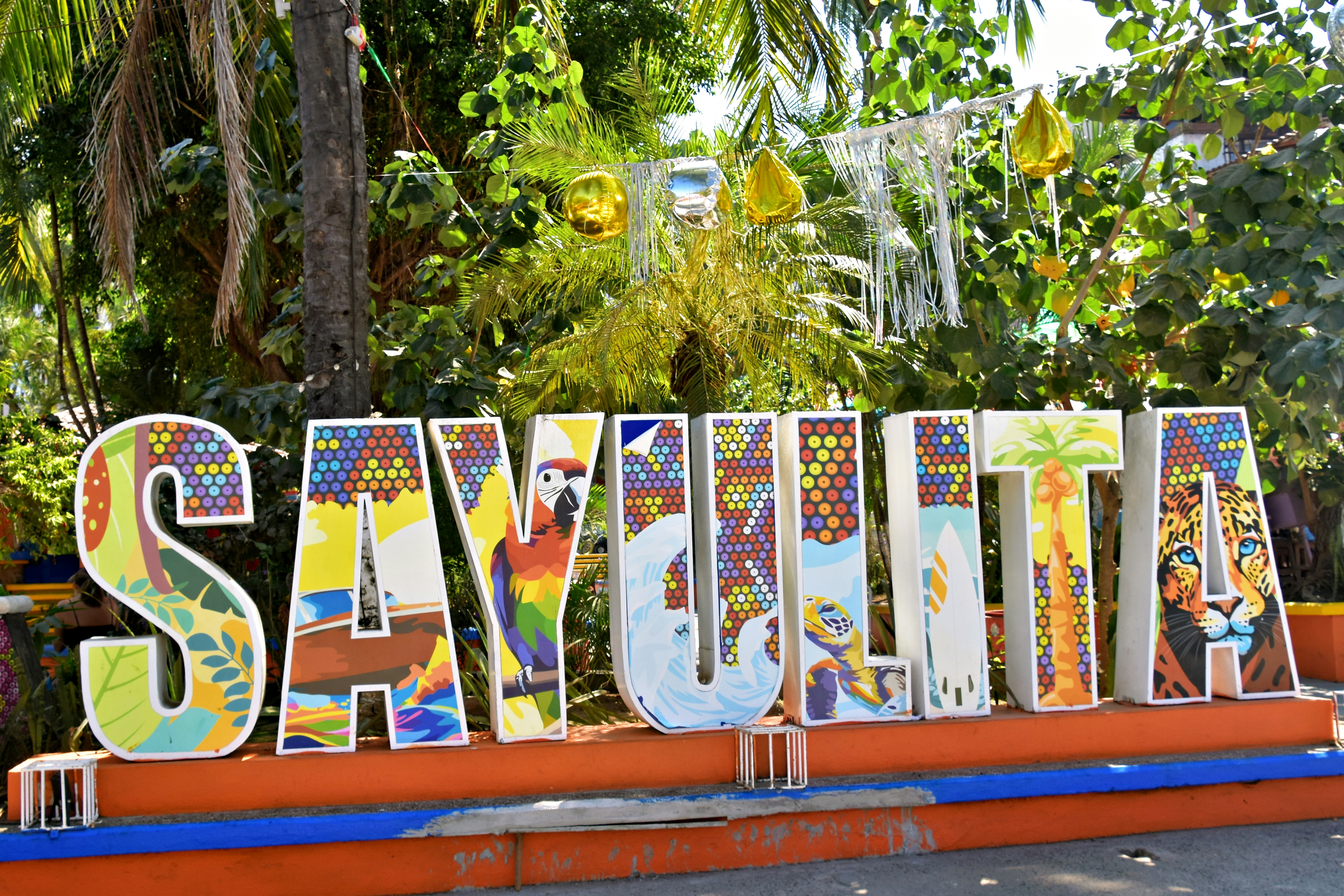 Colorful sayulita sign with tropical decorations