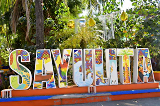 Colorful sayulita sign with tropical decorations
