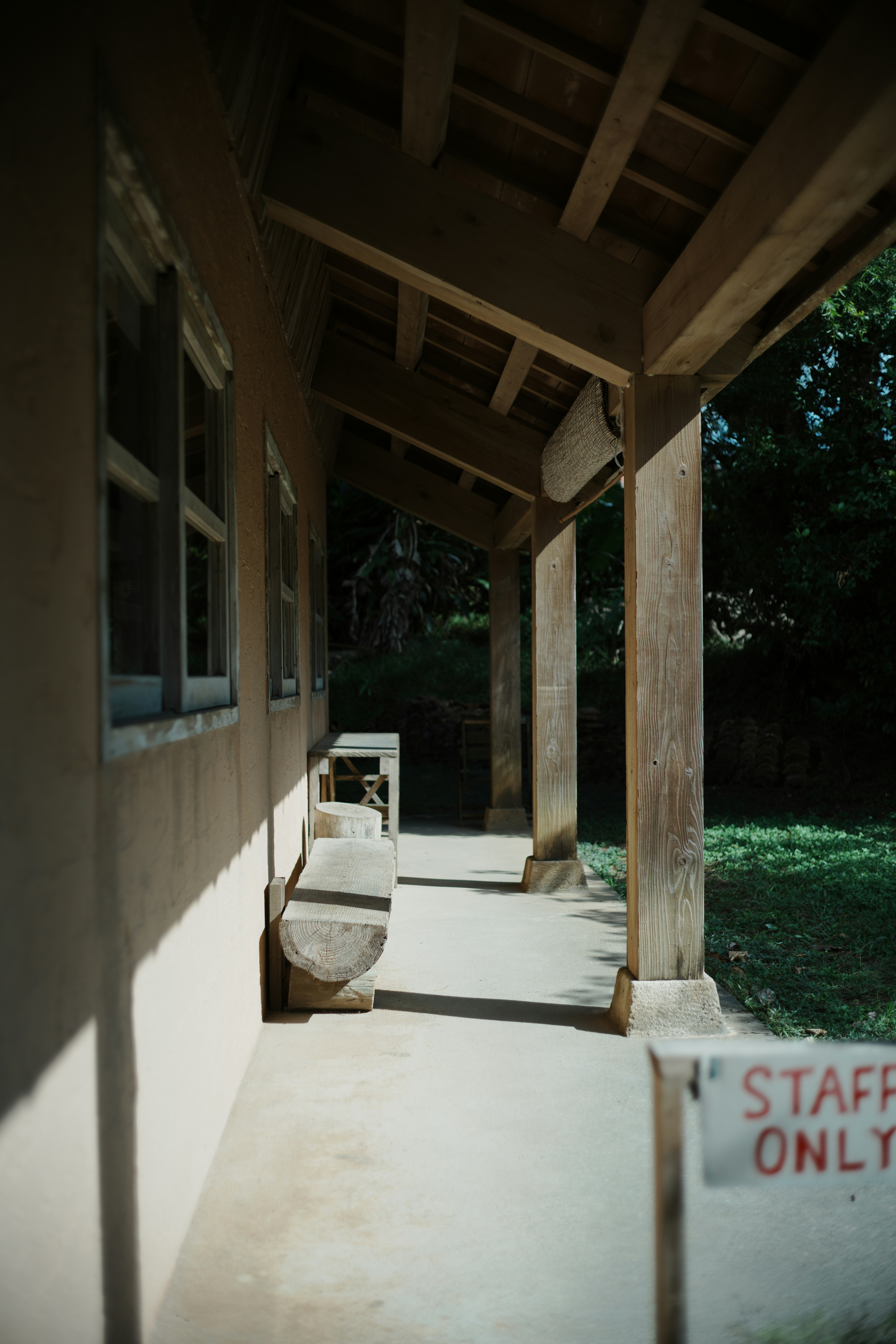 Wooden porch with a sign that says staff only.