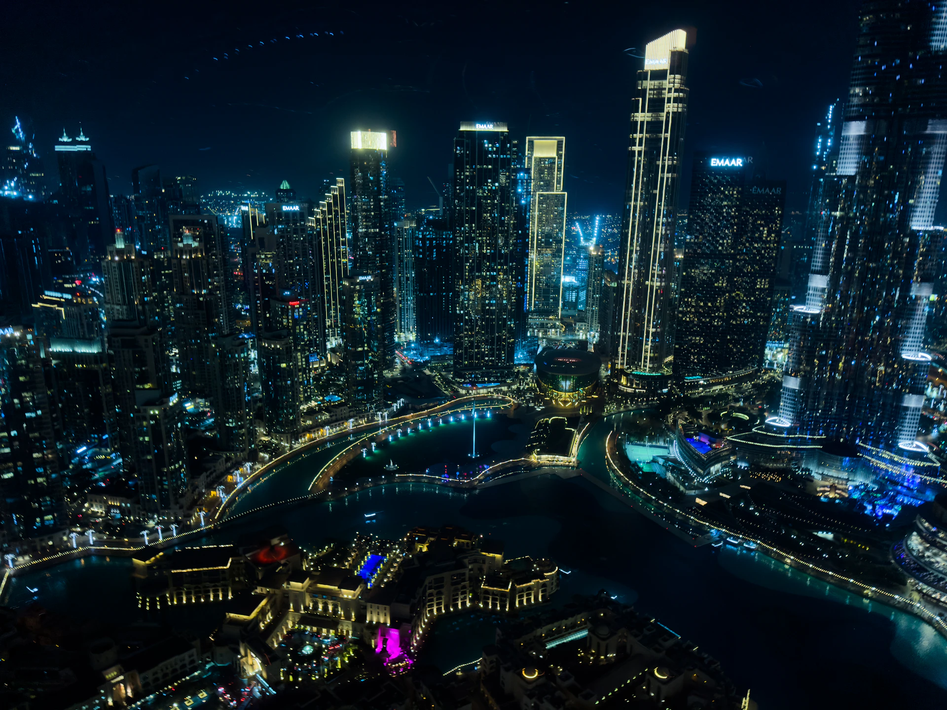 Modern cityscape with illuminated skyscrapers at night