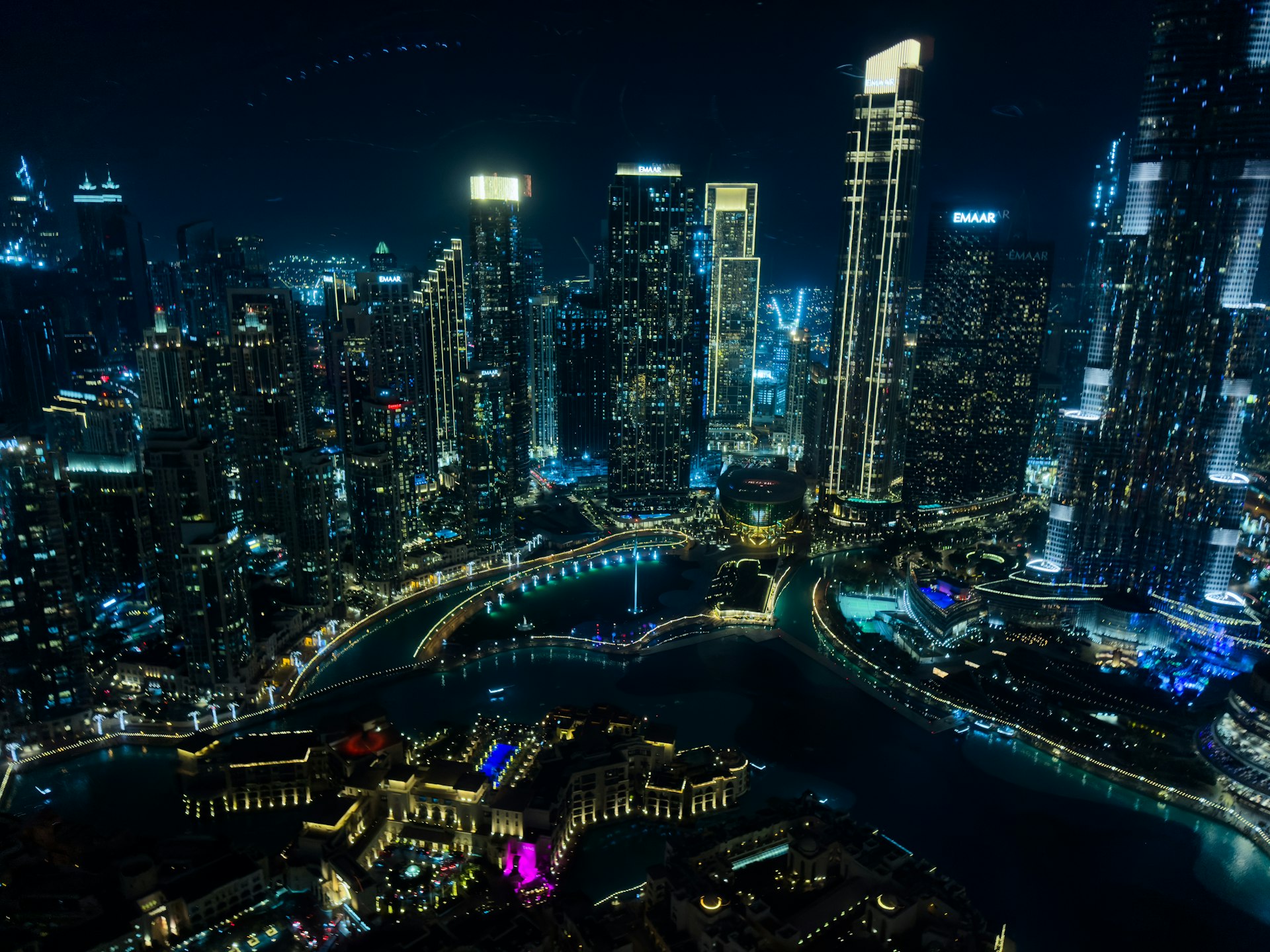 Modern cityscape with illuminated skyscrapers at night