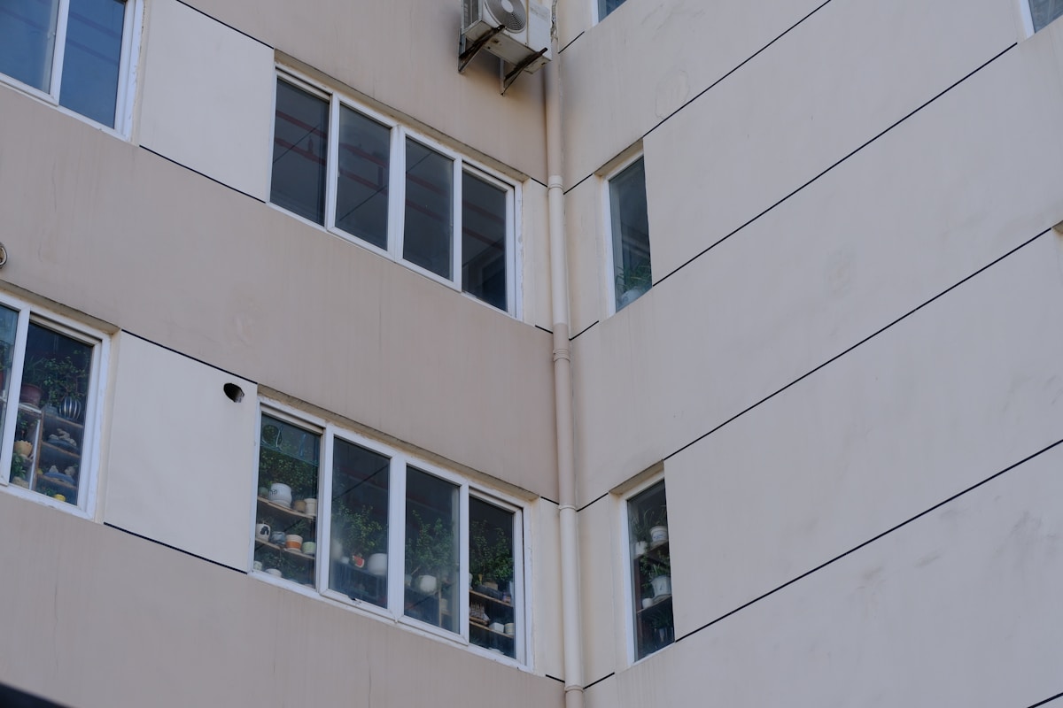 Exterior of a cream-colored building with windows
