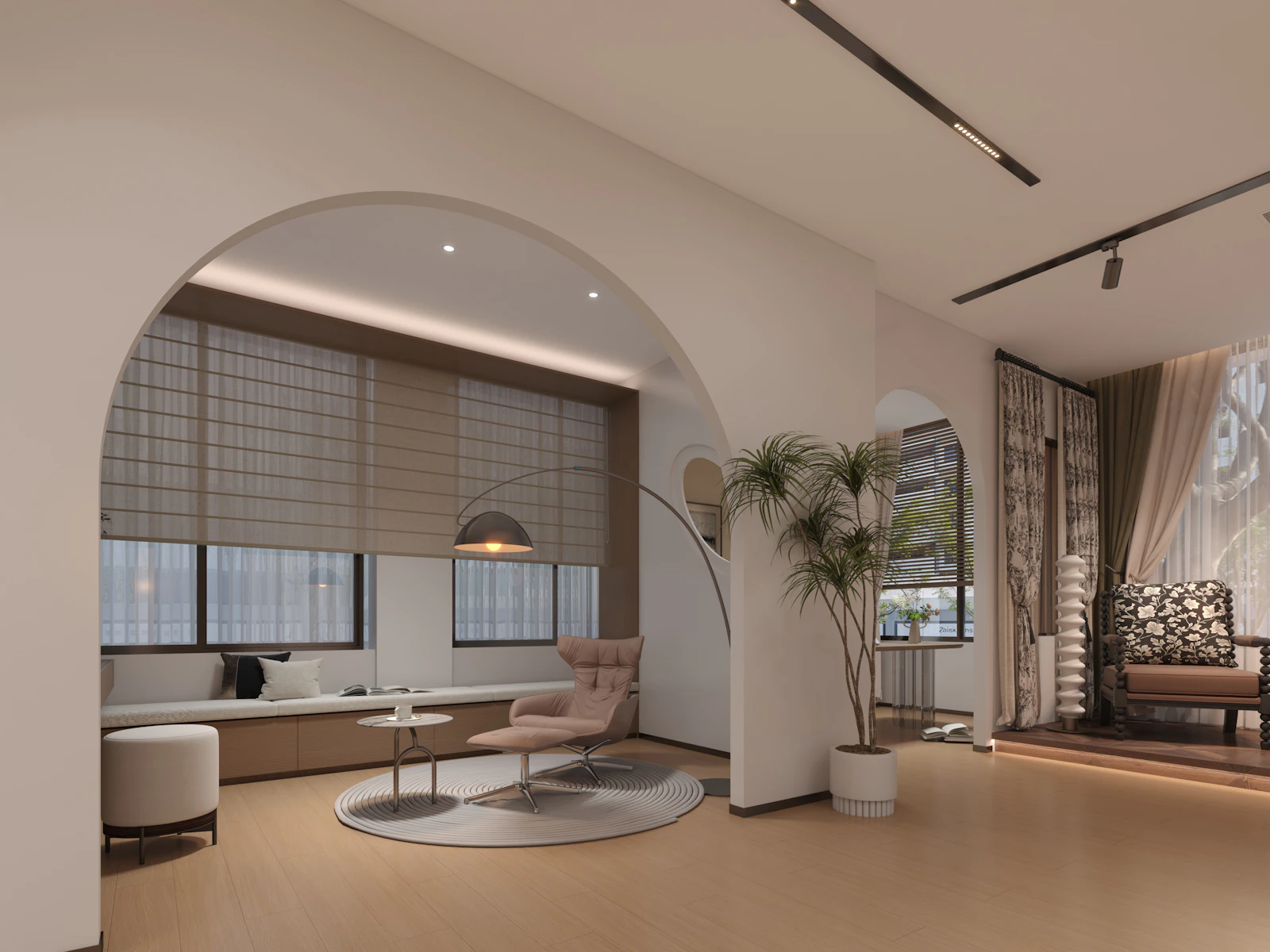 Living room seen through a wide plaster arch, with soft seating, shaded windows and a tall plant