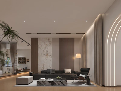 Modern living room with stylish furniture and ambient lighting.