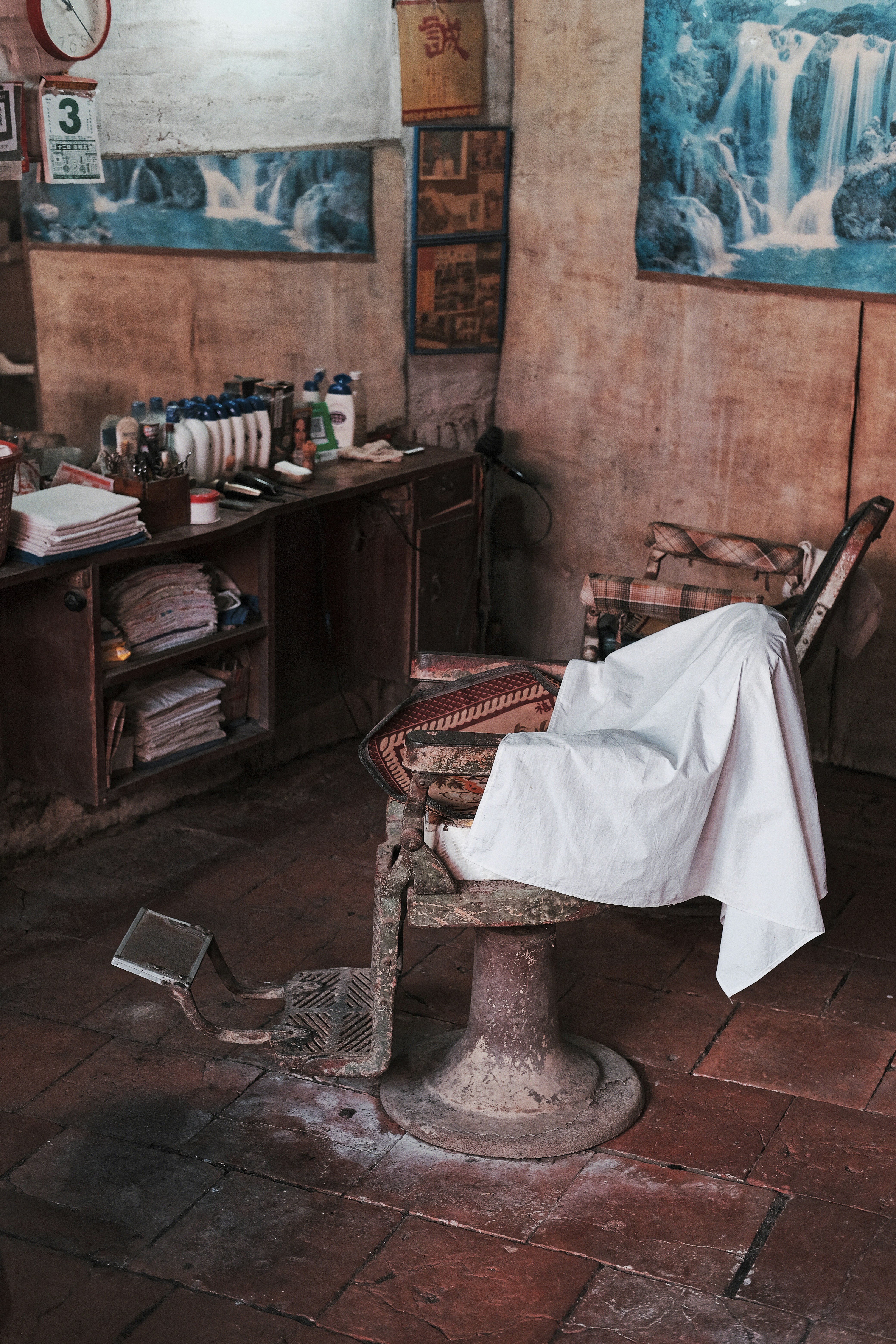 Vintage barber chair covered with white cloth