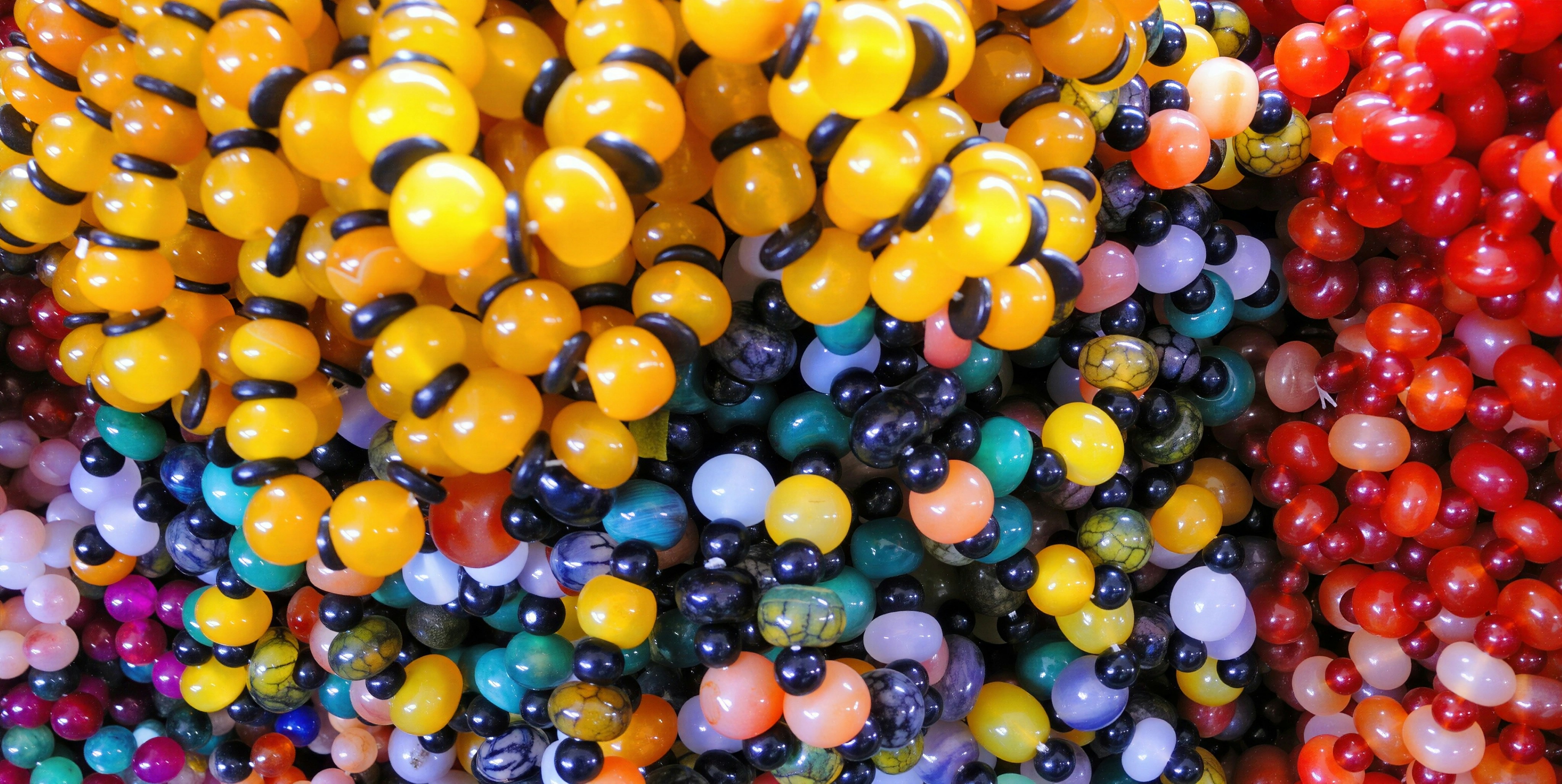 Close-up of colorful beads resembling bumblebees
