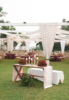 Outdoor wedding reception with elegant table decorations