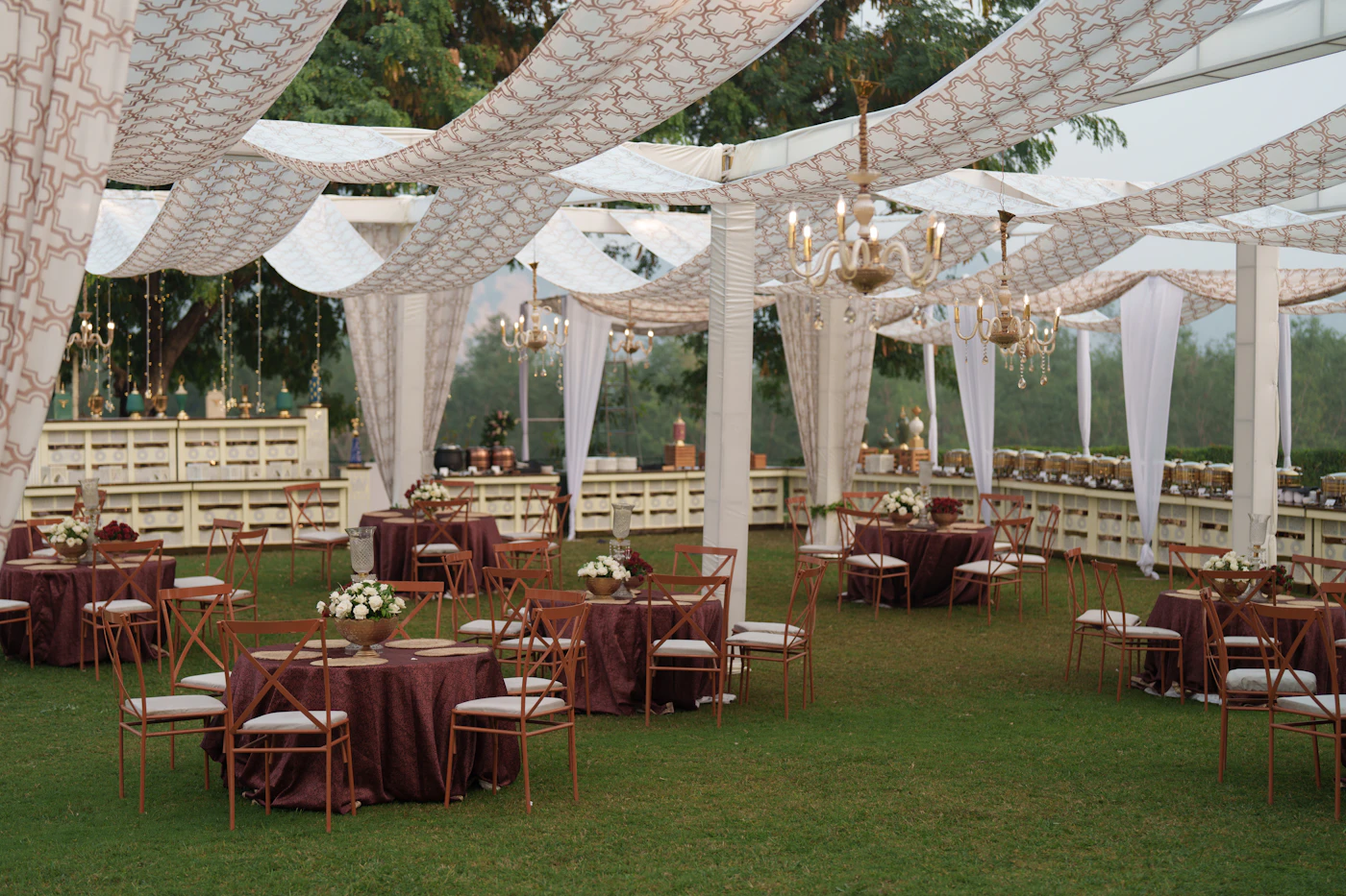 Rain plan templates for outdoor tented receptions — Guests stay dry with provided umbrellas during a rainy wedding ceremony transition.