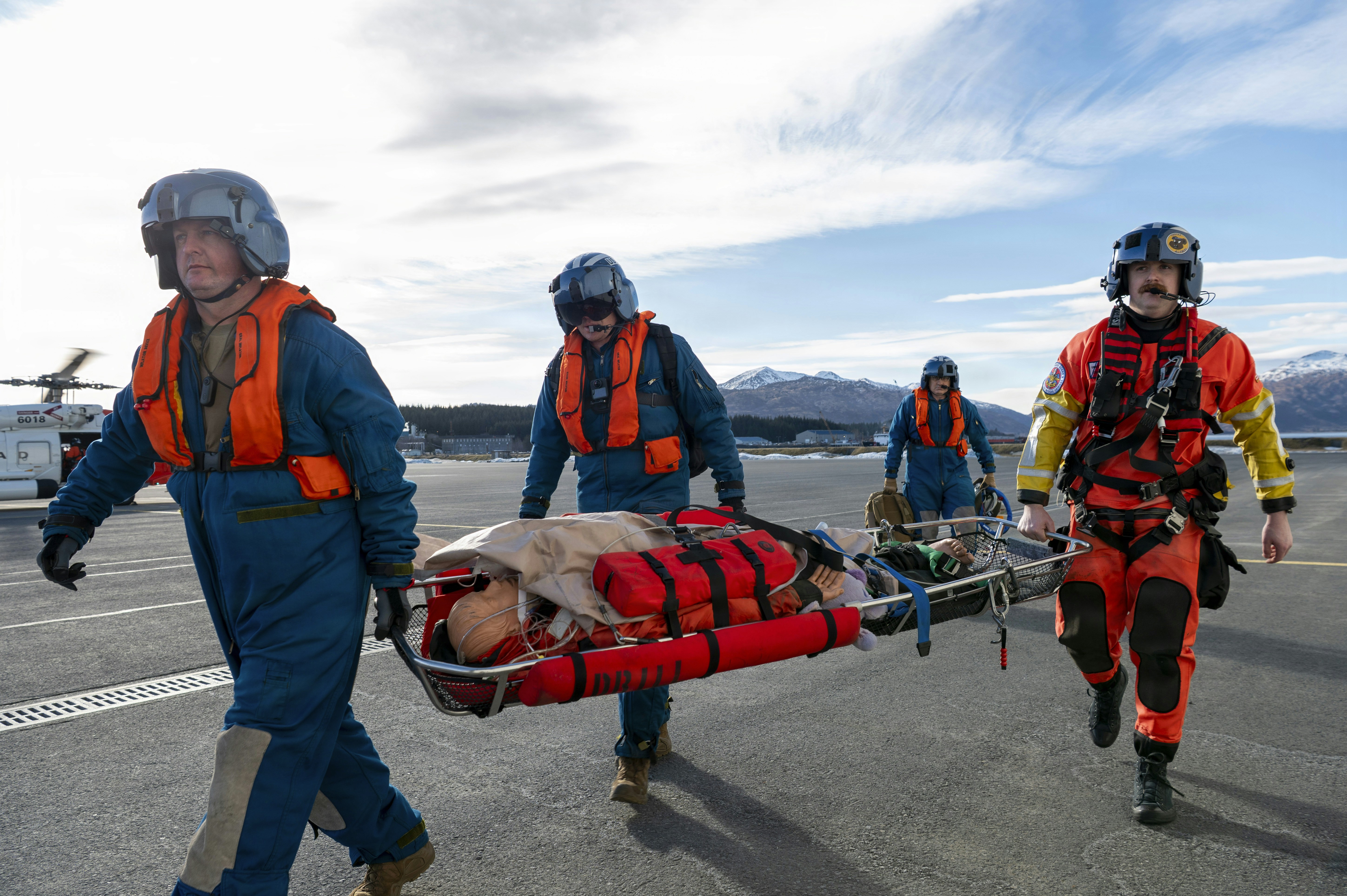 Rescuers carry injured person on a stretcher
