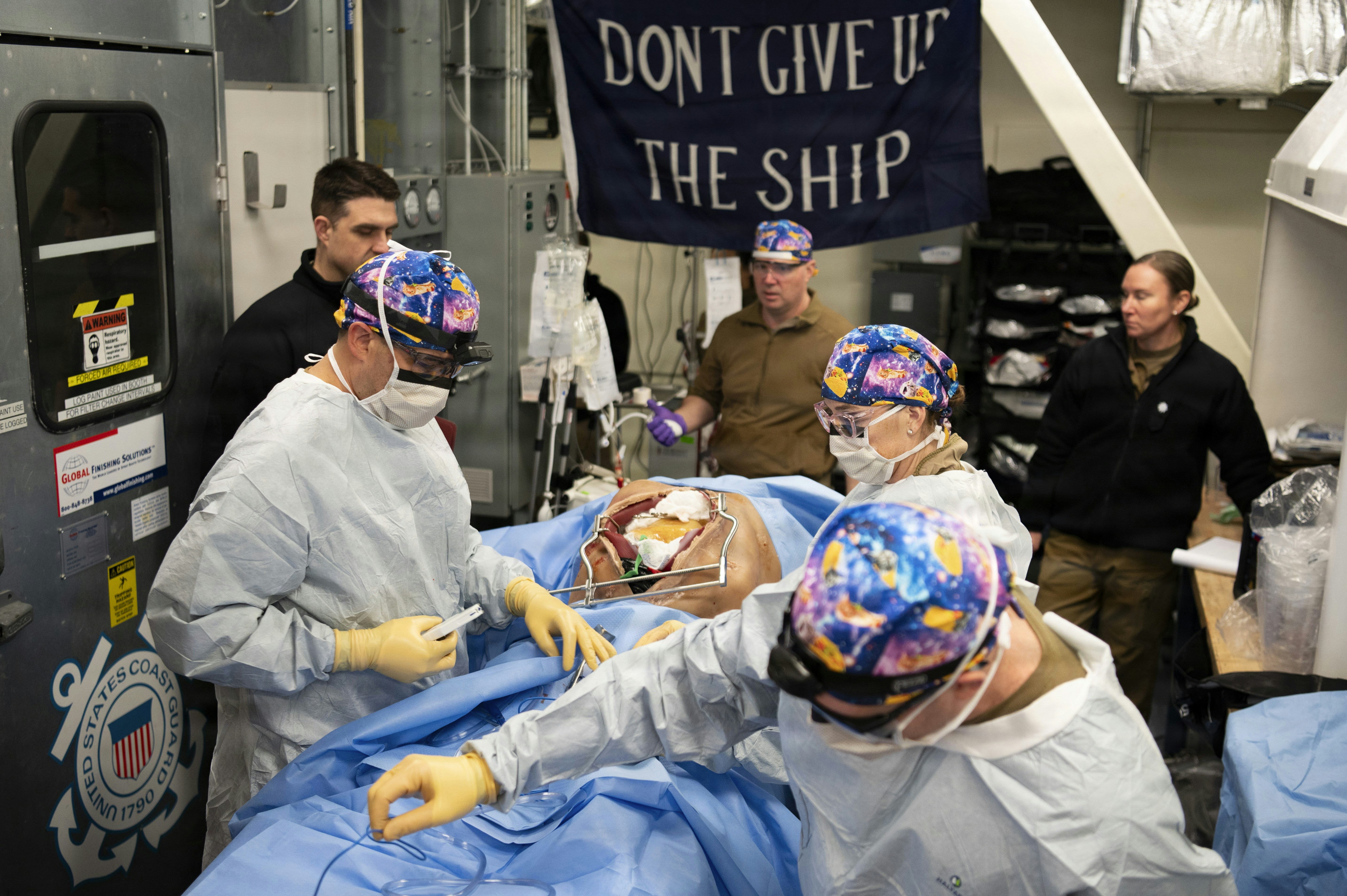 Medical team performs surgery aboard a ship