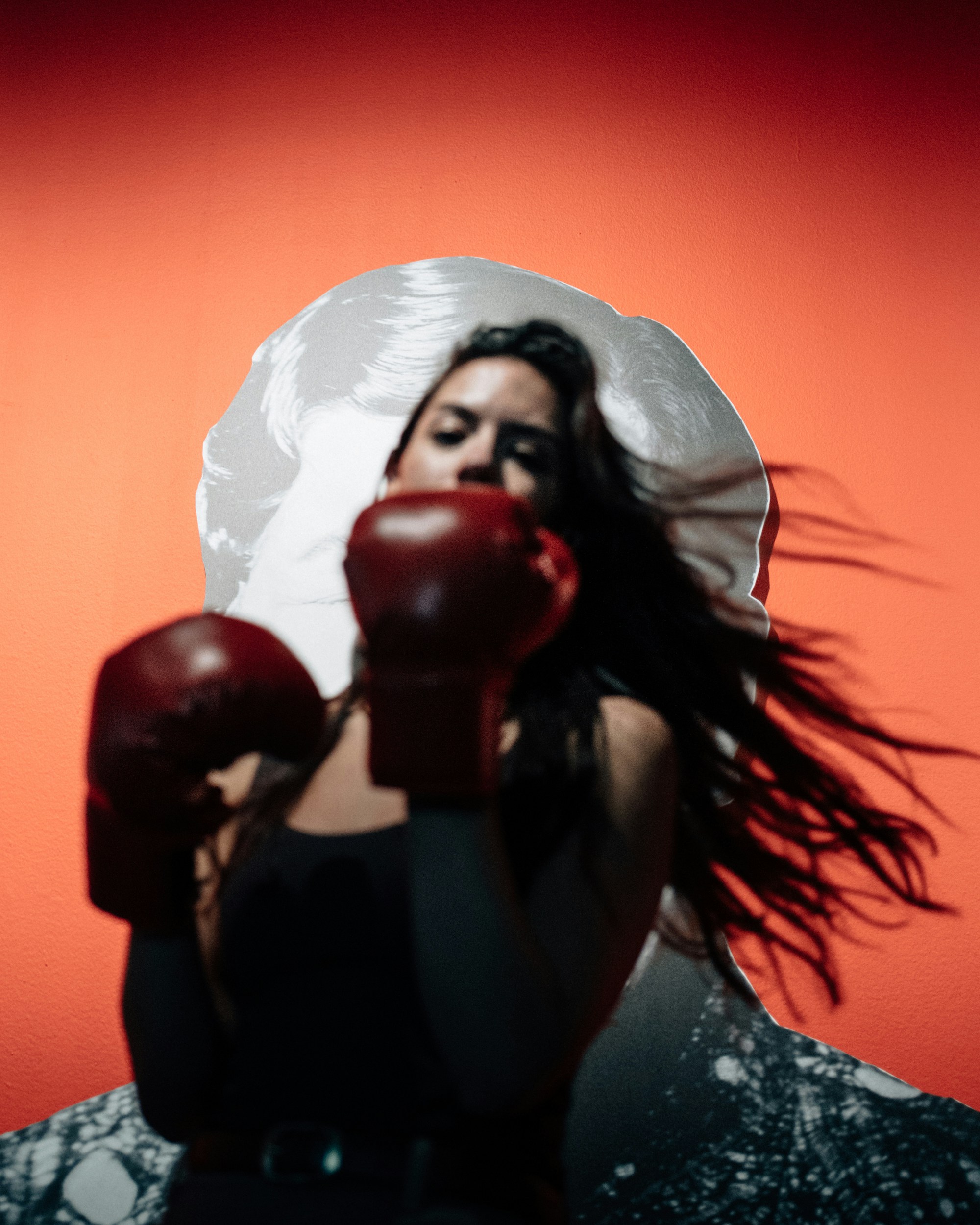 Woman in boxing gloves with flowing hair