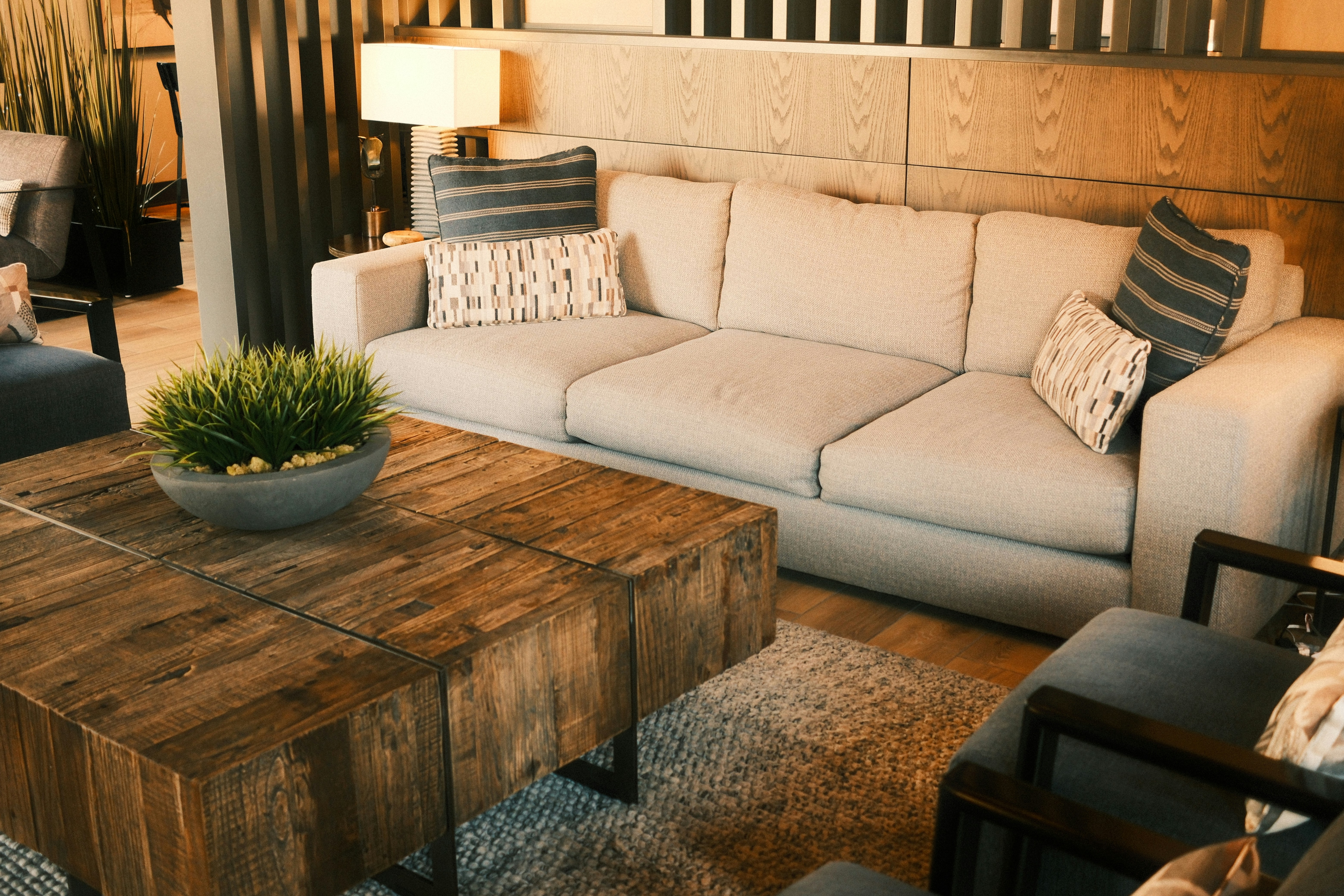 Living room with couch, coffee table, and chairs.
