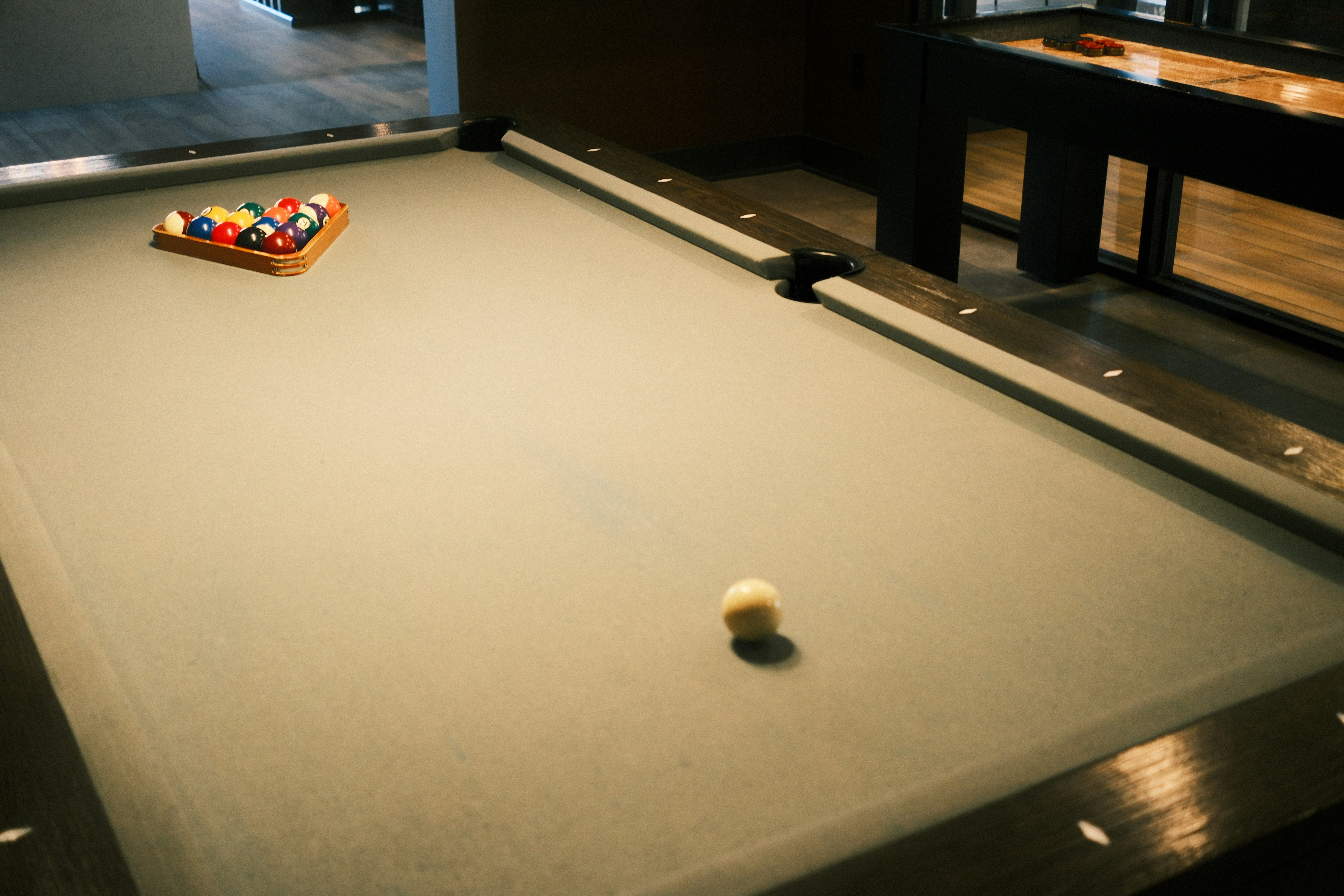 Billiard balls arranged on a pool table