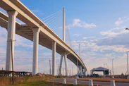 A modern cable-stayed bridge under a blue sky