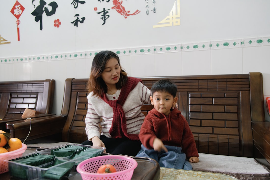 Woman and child sitting together, representing parent-child bond