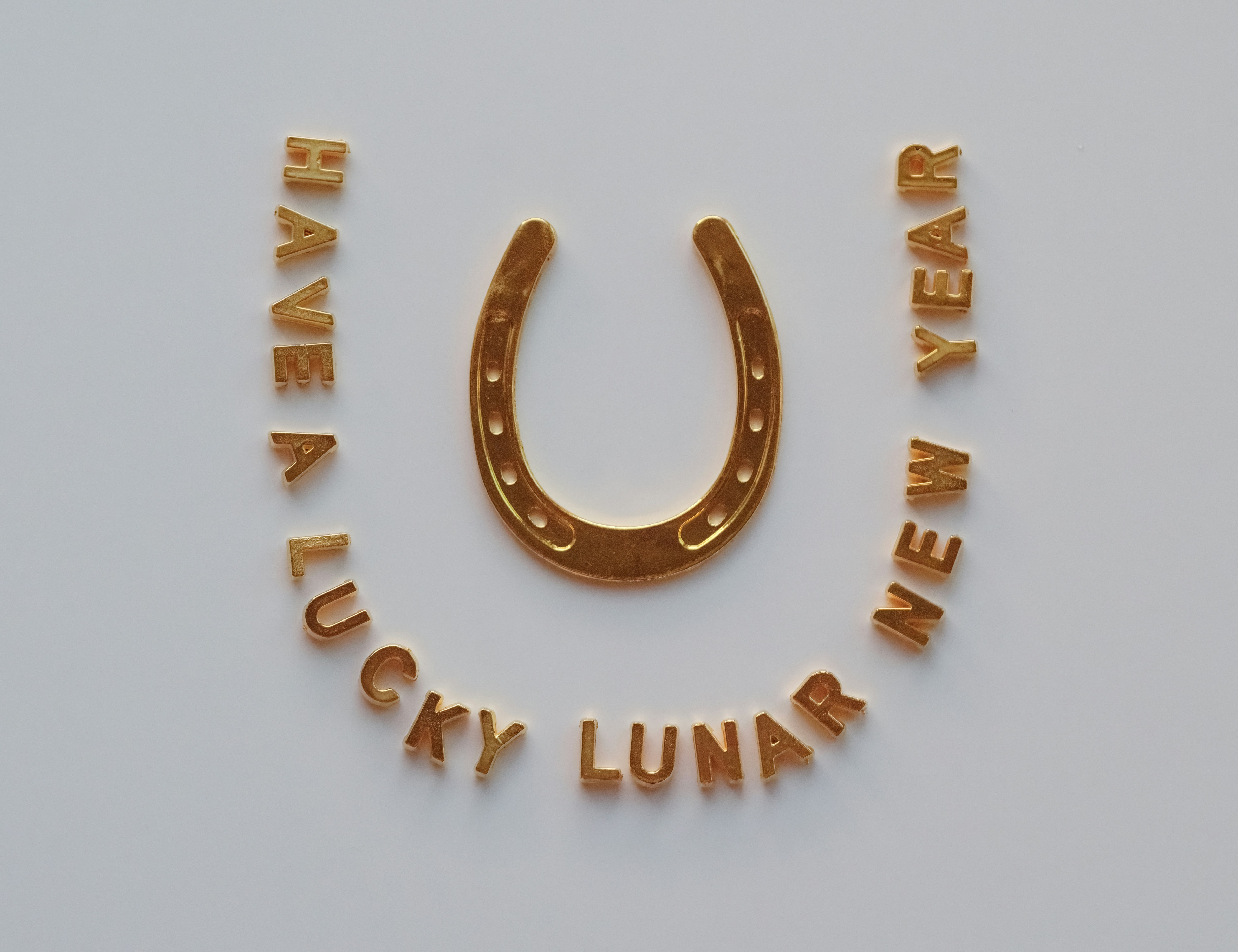 Golden horseshoe with lucky lunar new year text