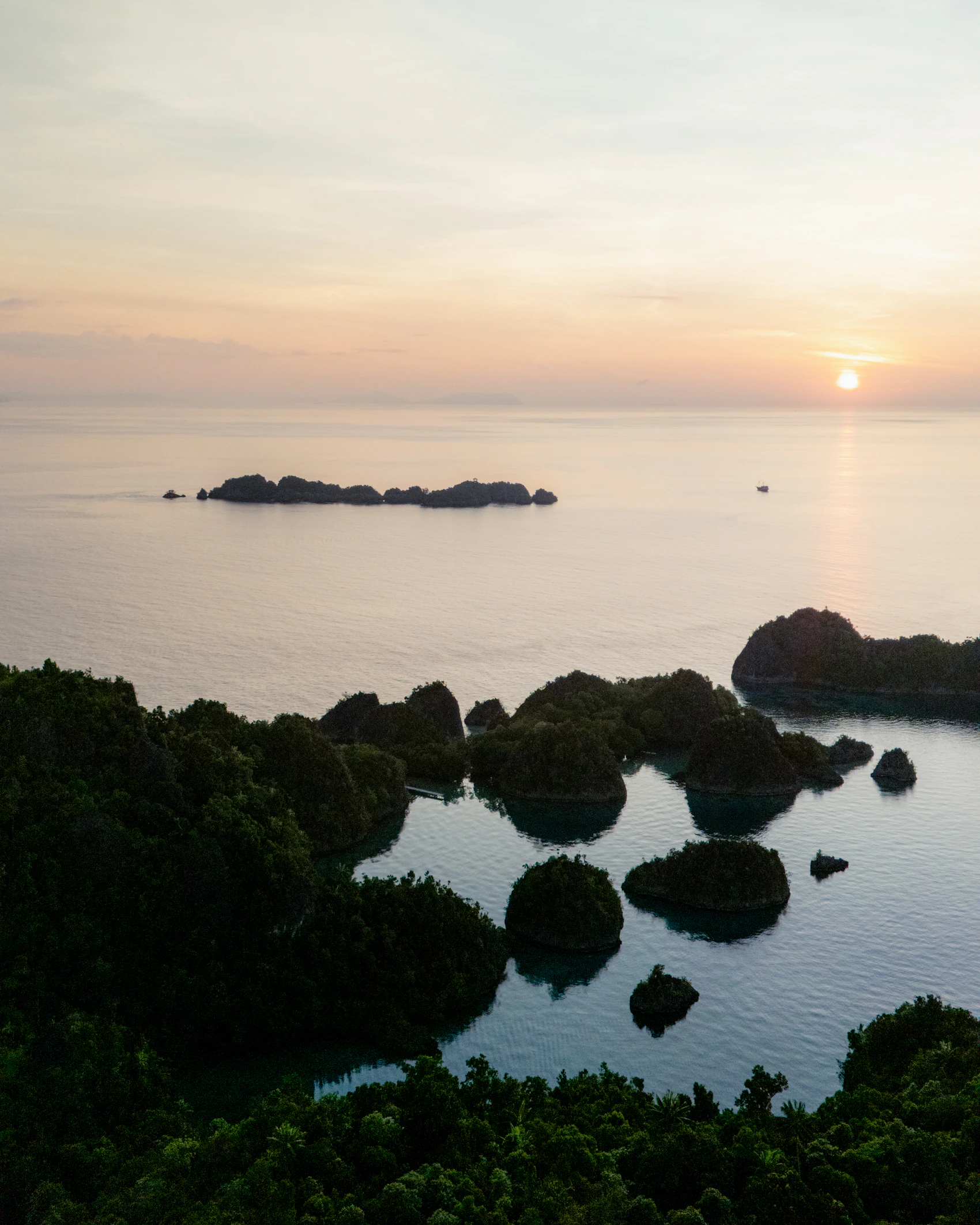 Golden sunset over the islands of Raja Ampat, Indonesia