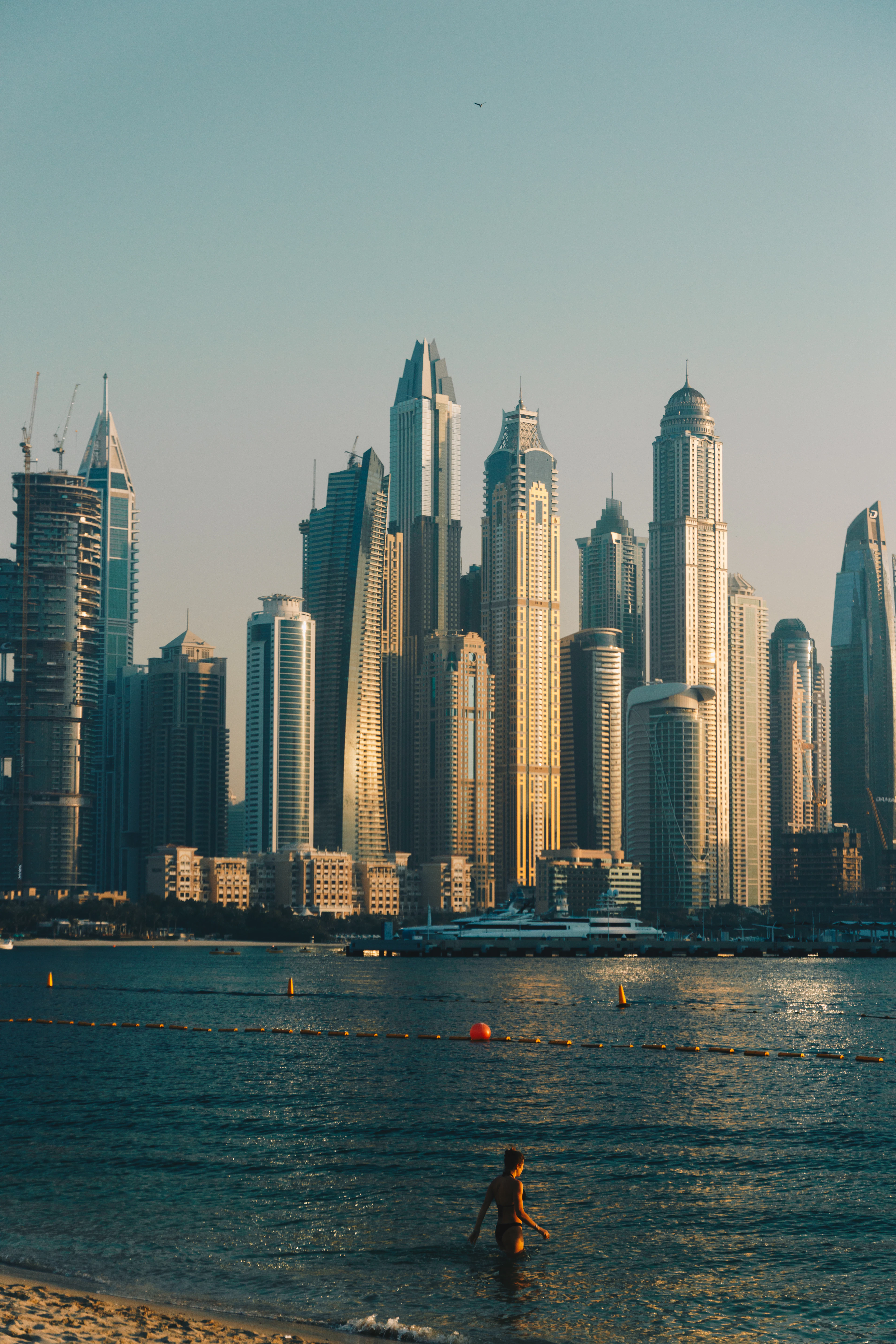 Tall residential towers rising above the beach in Dubai