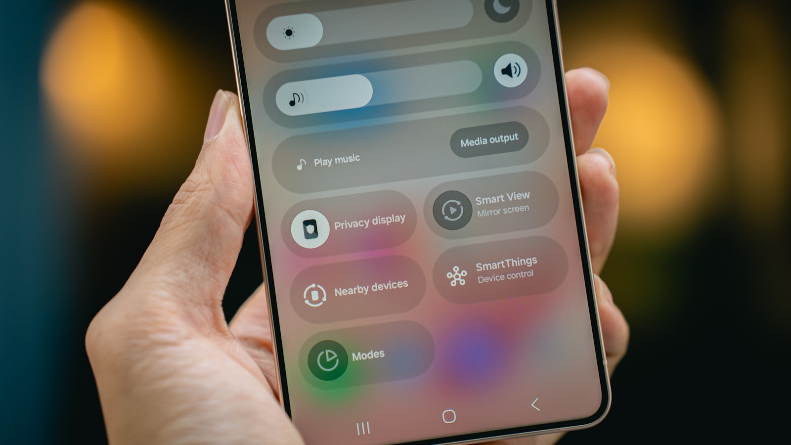 Person holding a smartphone with settings menu for eSIM or SIM card configuration