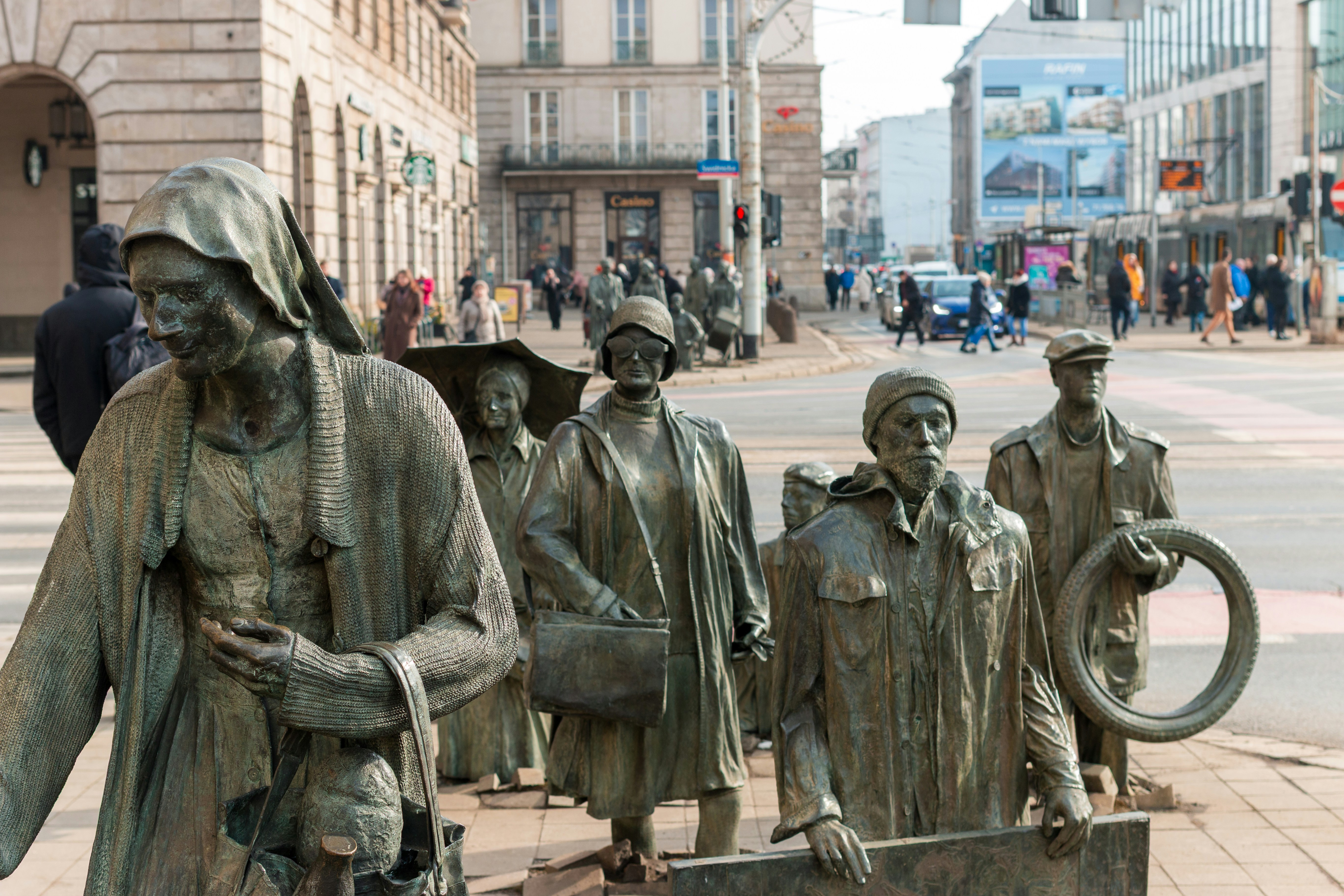 Bronze statues of people walking on a city street. photo – Free Tourism ...