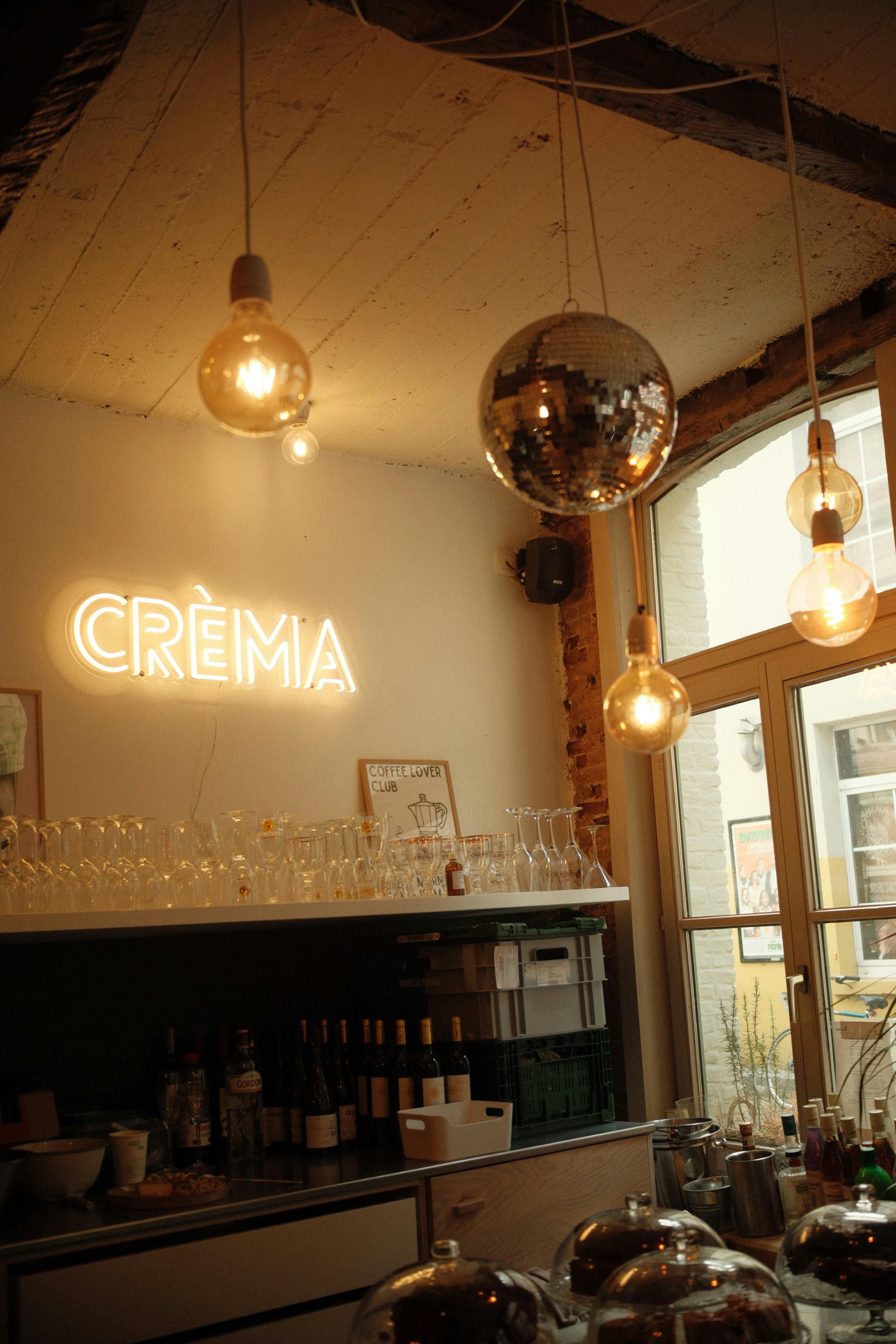 Neon sign and disco ball in a cafe
