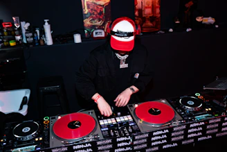 Dj playing music on turntables at a party