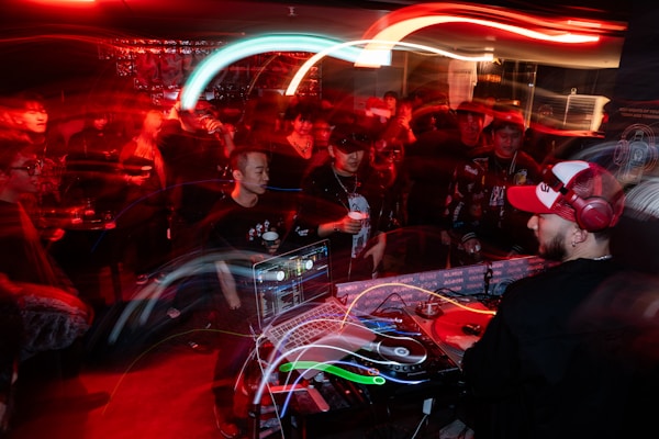 DJ playing music for concert crowd