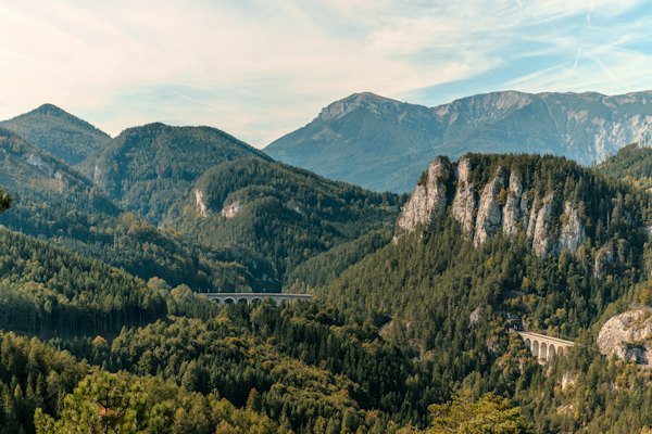 Lush green mountains with a rocky outcrop in the foreground — Wachau Valley, Austria