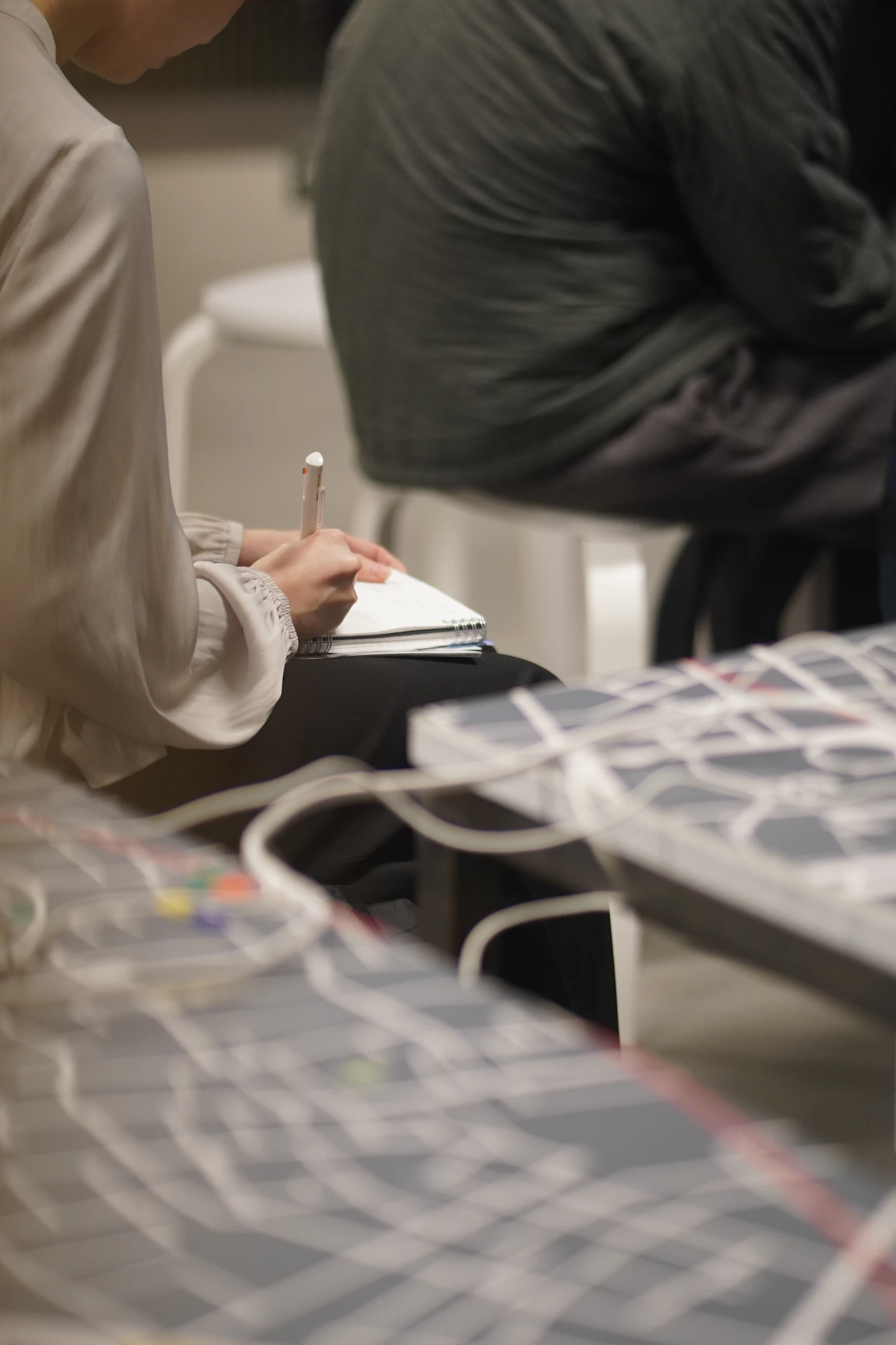 Stock photo of a participant taking notes in a learning session