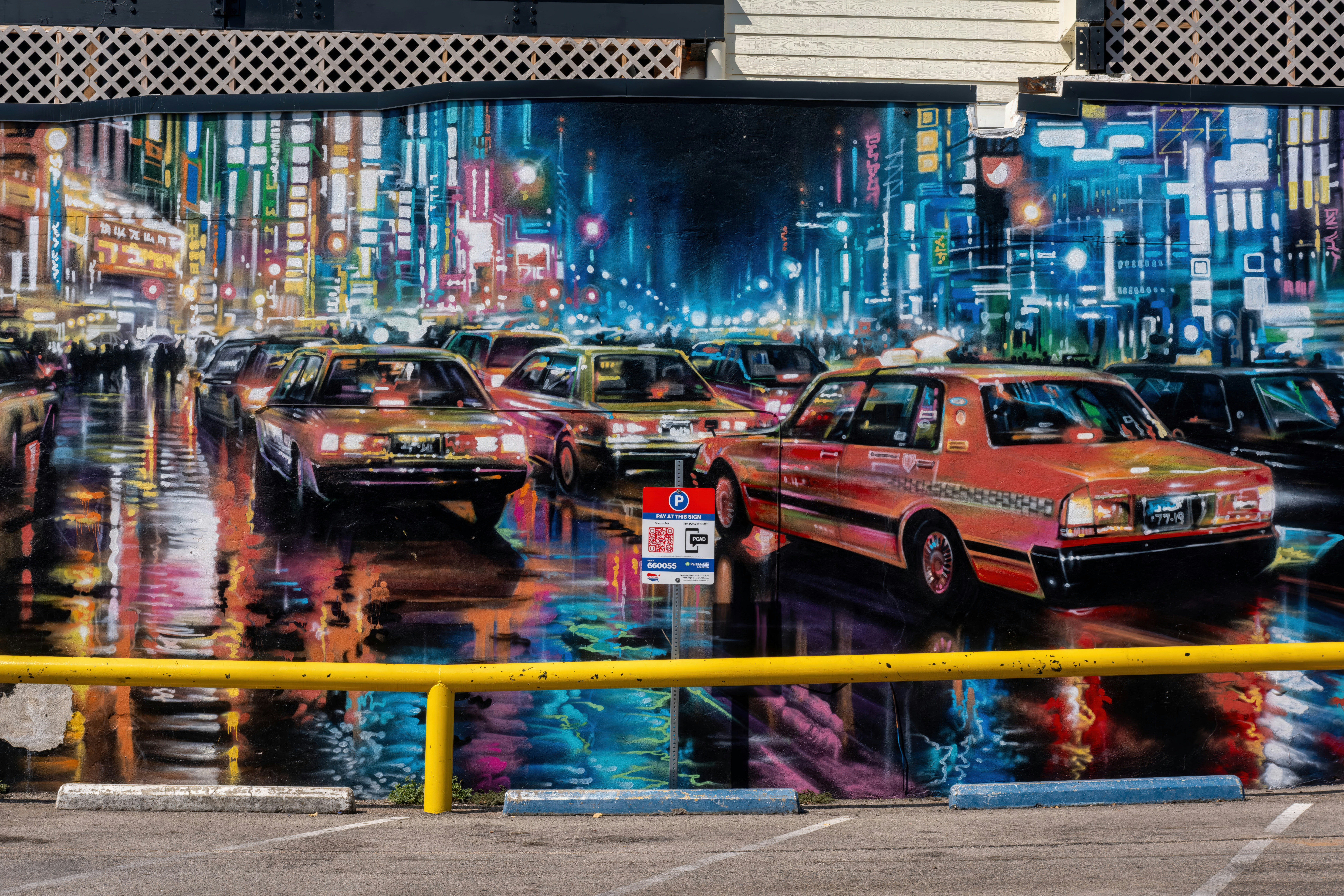 Deep Ellum wet street with neon city lights reflection